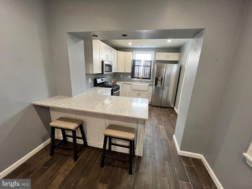 Traditional Harrowgate Row/Townhome with a covered, open Porch. Straight thru style with Livingroom with wood burning stove, and then a beautiful Quartz countered, peninsula, Kitchen with farm style sink, and an exit to the rear fenced yard with central air condenser. The basement is unfinished but offers plenty of potential additional living space, with glass block safety windows, gas utilities, and some pvc plumbing. The upper level offers 3 spacious Bedrooms with high ceilings, and a 3pc hallway Bathroom. Make your personal finishing touches and you’ll have immediate sweat equity!