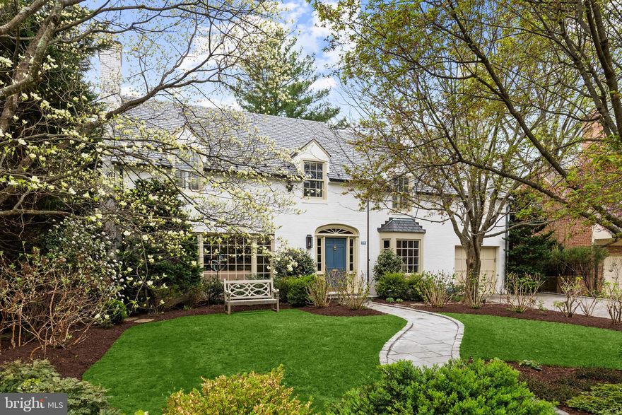 This gorgeous home is situated on a quiet, flat lot in Bethesda’s coveted Westmoreland Hills, with lush garden views from every room. Inside, the effortless flow between rooms is perfect for everyday living and gracious entertaining. The highly desirable layout also features four comfortably sized bedrooms, including a primary suite, all on the second floor. This is an immaculately maintained, thoughtfully updated residence in an idyllic setting, just a few blocks from the D.C. line. 

The exterior showcases timeless, quality materials: a Buckingham slate and copper roof, copper gutters, Bevolo lanterns, and flagstone paths edged in Belgian block. 

At the core of the home, the English-style kitchen is well-appointed and refined. A graceful arch over a limestone counter affirms that this is not a cookie-cutter build. Zellige tiles and slate floors add texture and character. A Sub-Zero fridge and Bosch dishwasher are concealed behind custom panels, while floor-to-ceiling cabinets provide abundant storage. The sunny breakfast area, with a soaring ceiling and skylight, invites morning lingering. French doors beckon to the patio and garden, where camellias, magnolias, hydrangeas and David Austin roses provide a succession of blooms, and the green backdrop persists year-round. 

A series of distinctive spaces radiate from the kitchen: a striking hexagonal library (equally suited to be a playroom or sunroom) lined with custom built-ins; an elegant dining room with views that extend out a generous bay window; and both formal living and family rooms, each with oversized windows and its own fireplace. A mudroom between the kitchen and garage keeps outerwear out of view. 

Upstairs, the primary suite feels quietly luxurious, with a claw-foot tub, walk-in closet, and charming study overlooking the gardens. Each of the other bedrooms can easily accommodate zones for sleeping, study, and storage. Having a washer and dryer on this floor eases mundane routines. 

The lower level offers versatility, with a full bath, third fireplace, custom built-ins, and adaptable space that can serve as a rec room or home gym. An additional legal bedroom or private guest suite is also possible, with an exterior door leading to a side patio.

Modern enhancements have been integrated seamlessly. Automated irrigation and exterior lighting, an EV fast charger, a Ring doorbell, and a high-efficiency heat pump HVAC system ensure the home lives as beautifully as it looks.

Just moments away, Westmoreland Park features tennis courts, a playground, and wooded trails that connect to the scenic Capital Crescent Trail. The shops and dining of Spring Valley — including neighborhood favorites Millie’s and Wagshal’s — are all walkable, while commuting is refreshingly convenient via Massachusetts Avenue or nearby access points into Virginia and greater Maryland.