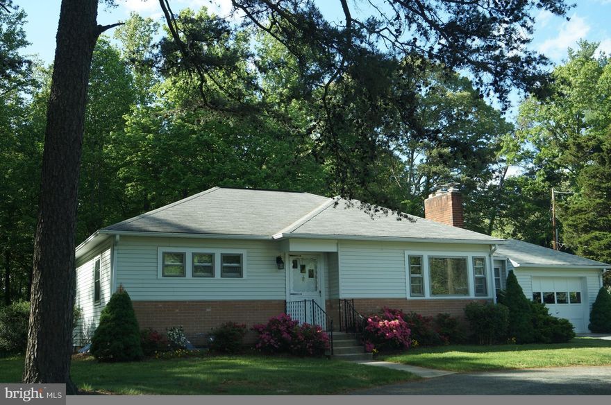 2 bedroom, 2 bath single family home with 6 acres on quiet street with easy access to Hoadly Road, Prince William Parkway and the 234 By-Pass.  One acre cleared for yard and the rest wooded providing quiet enjoyment close to shopping, transportation routes and commuter bus routes.  Newly remodeled.  Hardwood floors throughout. One car garage with garage door opener.   Full unfinished basement