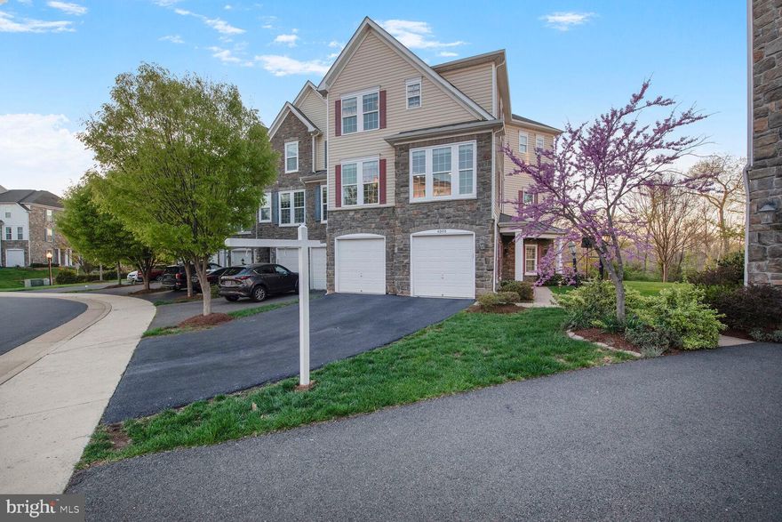 ***A rare single family like North East facing 2-car garage townhome on a premium lot with pond view in the heart of Brambleton! *** Welcome to 42458 Great Heron SQ, this 2012-built property boasts a generous living area of 2835 square feet, offering ample room for comfortable living. This End-unit Townhouse captivates with an abundance of natural light flooding in through large windows. Hardwood floors on main level and master bedroom, upgraded carpet with extra padding. 
***A particular highlight includes its very own private outdoor space that is perfect for enjoying & relaxing with lush green & pond view, Balcony off of Master Bedroom, a Deck off of the Kitchen and a beautiful Stone Patio***. 
The entry level has a full bathroom and a spacious rec room with potential for a legal 4th bedroom. The Main level comprises of a spacious open layout with upgraded gourmet kitchen and extended island complete with GE profile stainless steel appliances (Double Wall oven, Gas stove, Microwave, Refrigerator and Dishwasher). Microwave and Dishwasher replaced in 2021 and walk in Pantry. Adjacent to the kitchen is the family room with a gas fireplace. An expansive Living & Dining room perfect for family gatherings and entertaining. The Upper level includes primary suite with two vast walk-in closets featuring an upgraded bathroom with a dual vanity, a soaking tub and oversized shower. Two additional bedrooms, a second full bath with double vanity, and a convenient laundry room complete this level. 
***Community amenities: The Brambleton HOA includes FIOS high-speed internet, cable, backyard landscaping and maintenance, plus access to several pools, community centers and the vast trail network for biking, walking & running. *** 
Briarwood High School and Brambleton Town center (Movie Theater, Grocery, Library, retails stores, etc.,) are within walking distance. Just minutes to Brambleton Regional Park & Golf Club, Hanson Regional Park (257-acre regional park) and the Reservoir Park (1000-acre reservoir and waterfront for Kayaking, Nature trail).   ***This townhouse promises not just a home but a delightful home and community with great options for commute via rt 267, Ashburn Metro (< 5 miles), Rt 7 & 28. Be sure to snatch up this fantastic opportunity and kickstart your new chapter in style. Act now, call for a showing today! ***