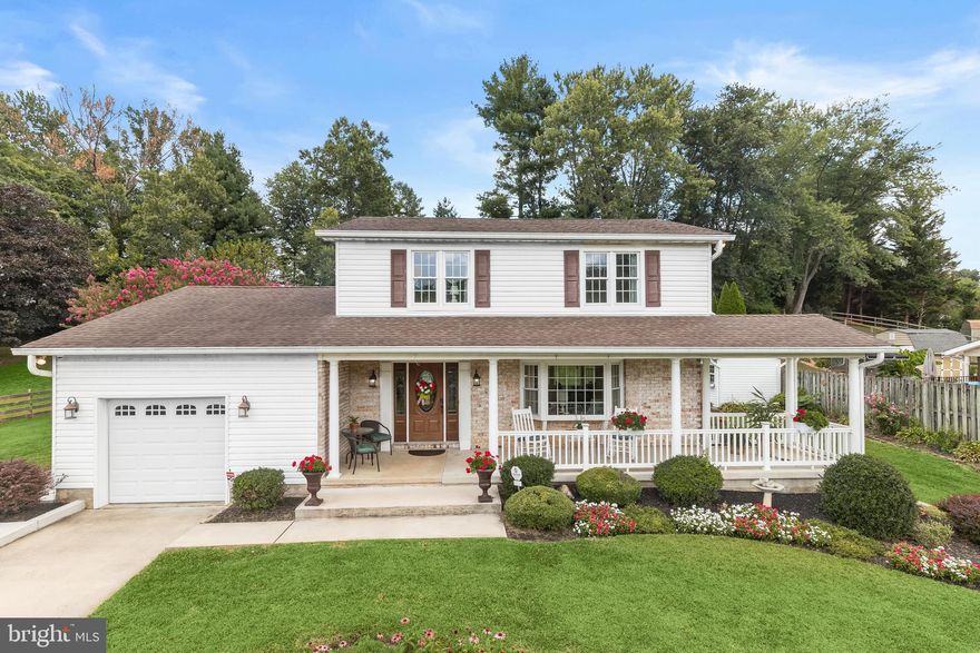 Beautifully sited at the end of a cul-de-sac in sought after Round Acres, this 4-bedroom, 2.5-bath home has been lovingly maintained by its original owner and offers timeless beauty inside and out. Rich hardwood floors, a sophisticated color palette, and custom millwork set the stage for elegant living.
An inviting covered front porch with breathtaking views welcomes you, airy foyer that opens through a pillared entrance to the large living room, where crown molding, chair railing, and a sunny bay window create a warm feel. The formal dining room continues the refined look, perfect for memorable gatherings.
Your culinary skills will shine in the gourmet kitchen boasting stainless steel appliances, cherry cabinetry with under-cabinet lighting, and a planning station spotlighted by the decorative backsplash. A charming breakfast nook with a bay window offers views of the beautifully landscaped rear lawn.
Just off the kitchen, the family room features recessed lighting, hardwood floors, crown molding, and French-style sliders that lead to the composite platform deck. an ideal spot to relax and enjoy the sweeping lawn and exquisite surrounding landscaping.
Upstairs, the serene primary suite with an en-suite bath awaits, along with three additional bedrooms and an additional full bath, providing comfort for family and guests. The full, unfinished lower level with walk out stairs is ready for your personal touch and expansion ideas.
Located close to shopping, dining, MD-Rt. 1, and I-95, this home blends convenience with classic charm—truly checking all the boxes of the perfect home.