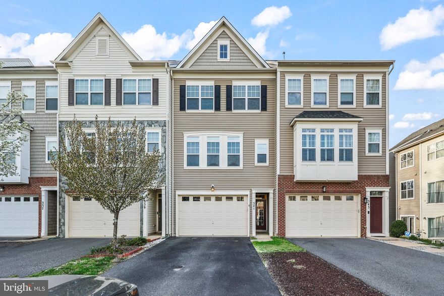 Beautiful 3 level 3 bedroom 2 1/2 bath 2 car garage townhome.  This townhome boasts over 2,764 square feet.  As you come into your new home you will find gleaming hardwood floors, rec room with a walk-out to the rear fenced yard, storage closets, rough-in for 1/2 bath and access to the 2 car garage.  Throughout the home there is crown molding, chair rails, storage rooms, recessed lighting and ceiling fans.  As you proceed upstairs you will see stunning cherry hardwood flooring and lots of windows for natural light. An open concept living room with a separate dining area.  Powder room on this level.  The eat-in kitchen is both spacious and functional featuring lots of cabinets, an island with additional cabinets, pantry, stainless steel refrigerator, microwave and dishwasher.  Also featuring a gas stove.  The kitchen also walks out to a spacious deck overlooking trees.   The upper level boasts a generous primary bedroom with a large walk-in closet and lots of windows.  The Primary bathroom has dual sinks, soaking tub, and a separate shower.  Two additional bedrooms both with ceiling fans.  Laundry Room with cabinets and washer/dryer hook-up.  Full hall bath. Location makes this one a winner with close proximity to I-95.  Close to shopping, restaurants and commuter lots.  Don't miss the trail to Smith Lake Park and all the community amenities you will need such as a pool, basketball court, tot-lots and clubhouse.   
Come make this your new home!