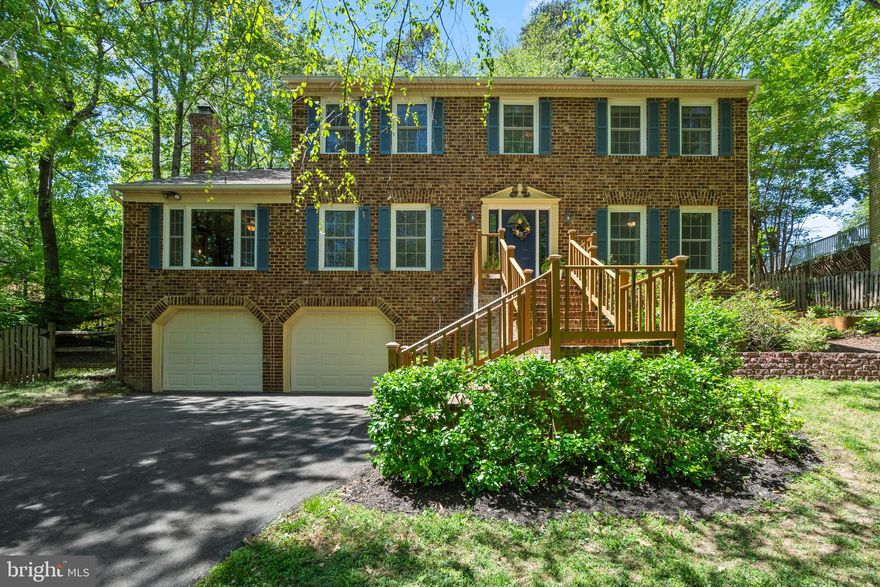Move right into this beautifully updated 4-bedroom, 2.5-bath, 3-level Colonial backing to the golf course in amenity-rich Aquia Harbour. The main level showcases wide-plank hand-scraped hardwood floors throughout the whole living area except the kitchen and the half bath, updated designer lighting, and a welcoming foyer with hardwood stairs and iron balusters. Formal living and dining rooms feature hardwood flooring, moldings, and a bay window. The renovated gourmet kitchen offers luxury vinyl plank flooring, quartz countertops with a breakfast bar, pull-out cabinet shelving, recessed lighting, a double door pantry, and stainless steel appliances, including a KitchenAid wall oven and cooktop. The adjoining breakfast room includes a bay window and access to the rear deck. The updated half bath features luxury vinyl plank flooring, a bathroom vanity, and wainscoting. The family room is appointed with hardwood floors, two ceiling fans with lights, wainscoting, a wood-burning fireplace with brick hearth and mantel, and a double atrium door leading to the deck. A private office with dual entry doors and hardwood floors completes the main level.  Upstairs, the primary suite includes new carpet (2024), a ceiling fan with light, a walk-in closet plus an additional closet, and a luxurious en-suite bath with ceramic plank tile flooring, a dual-sink granite vanity, a step-in shower with ceramic tile surround and frameless glass enclosure, a freestanding tub with handheld body spray, skylight, ceiling fan, and attic access. Bedrooms two through four all feature new carpets (2024) and ceiling fans with lights, with bedrooms three and four offering double-door closets. The updated hall bath includes ceramic plank tile, a granite vanity with storage, and a step-in shower with floor-to-ceiling tile, a rain shower head, and body spray. The upper-level laundry room features hardwood floors, folding station, and conveys with a Whirlpool washer and dryer.  The unfinished lower level is ready for customization and includes a plumbing rough-in, windows, and access to the oversized two-car garage. Additional features include solid wood doors, a freshly power-washed exterior, a rear deck with new decking and stairs to grade, a fenced backyard with a conveying playground, and landscaped grounds with new mulch and raised beds. 

The oversized two-car garage includes double insulated doors, and the paved driveway accommodates up to six vehicles. The home also features double-pane, double-hung insulated vinyl windows with screens, a new architectural shingle roof (2023), a water heater (2019), and NEW HVAC (2025).  

Located just a few blocks from the golf course, pool, and country club, Aquia Harbour offers an impressive array of amenities, including two pools, a state-certified police force, fire department, marina with boat ramp and fishing pier, kayak and canoe launches, a golf course with pro shop, putting green and driving range, the clubhouse restaurant, dog park, horse stables and riding trails, secure storage lot, community garden, highly rated preschool, fishing park, and eight additional parks with tot lots, tennis and basketball courts. Residents also enjoy frequent community events such as Independence Day fireworks, Oktoberfest, and movie and game nights.