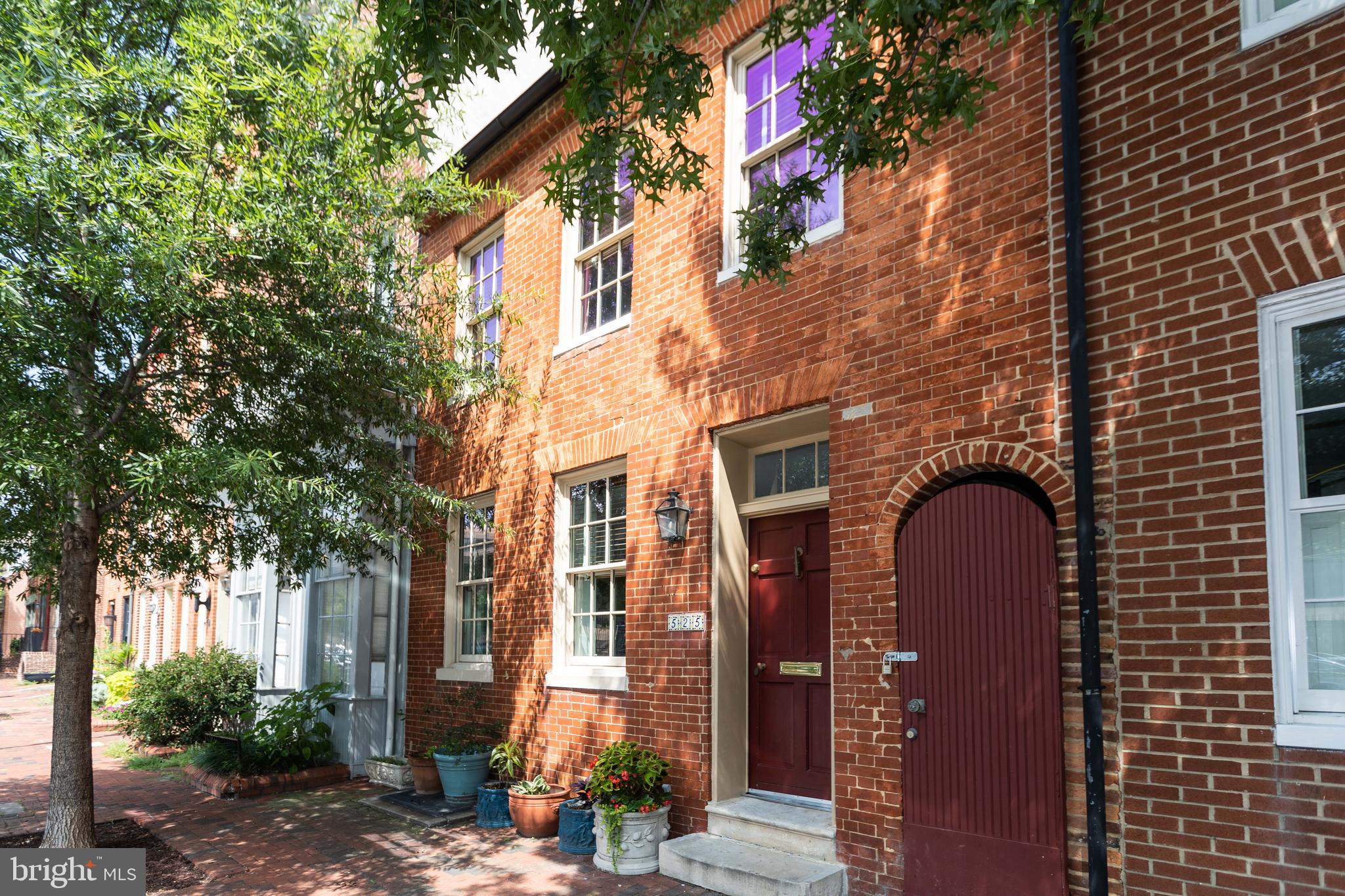 A truly rare offering in Otterbein, one of Baltimore’s most charming and preserved neighborhoods. Initially constructed in the late 1700’s, this unique home was transformed to combine the original structure to a carriage house, offering a unique and versatile floor plan perfect for an in-law suite, home office, theater or anything else you can dream of. Step inside and you’ll see how the past and present have been seamlessly connected, offering abundant space, charm, ventilation and tons of sunlight throughout the day. Tall ceilings, wainscotting, molding, hardwood floors and ample light flow throughout this home. The home offers over 2,300 of total usable living space plus a basement and large breezeway to easily store your bikes, kayak or tools. The main level offers a living/dining room with a decorative fireplace & large windows leading to a renovated kitchen with an island, marble slab countertops and backsplash, stainless steel appliances & a view of a private courtyard. Next step into a cozy courtyard foyer followed by a sunroom with fabulous windows. The bi-level carriage house offers a bedroom, full bathroom and family room framed by a cathedral window. The courtyard has been transformed into a private oasis great for grilling, entertaining and more. The upper levels of the original house offer two bedrooms, a sitting room/office (potential 4th bedroom) with a recently installed barn door and two renovated bathrooms. The airy, light-filled third level offers access to a new and fabulous rooftop deck with composite decking where you can watch the sunrise and listen to the birds sing. Large basement offers great storage and laundry. Simply put, the charm, history and character of this home is unmatched. You won’t find another floor plan like it. Come experience life in Otterbein – the heart of Baltimore City, easy street parking, steps to the stadiums, downtown, easy access to highways & boasting a walk score of 90, truly urban living at its best.