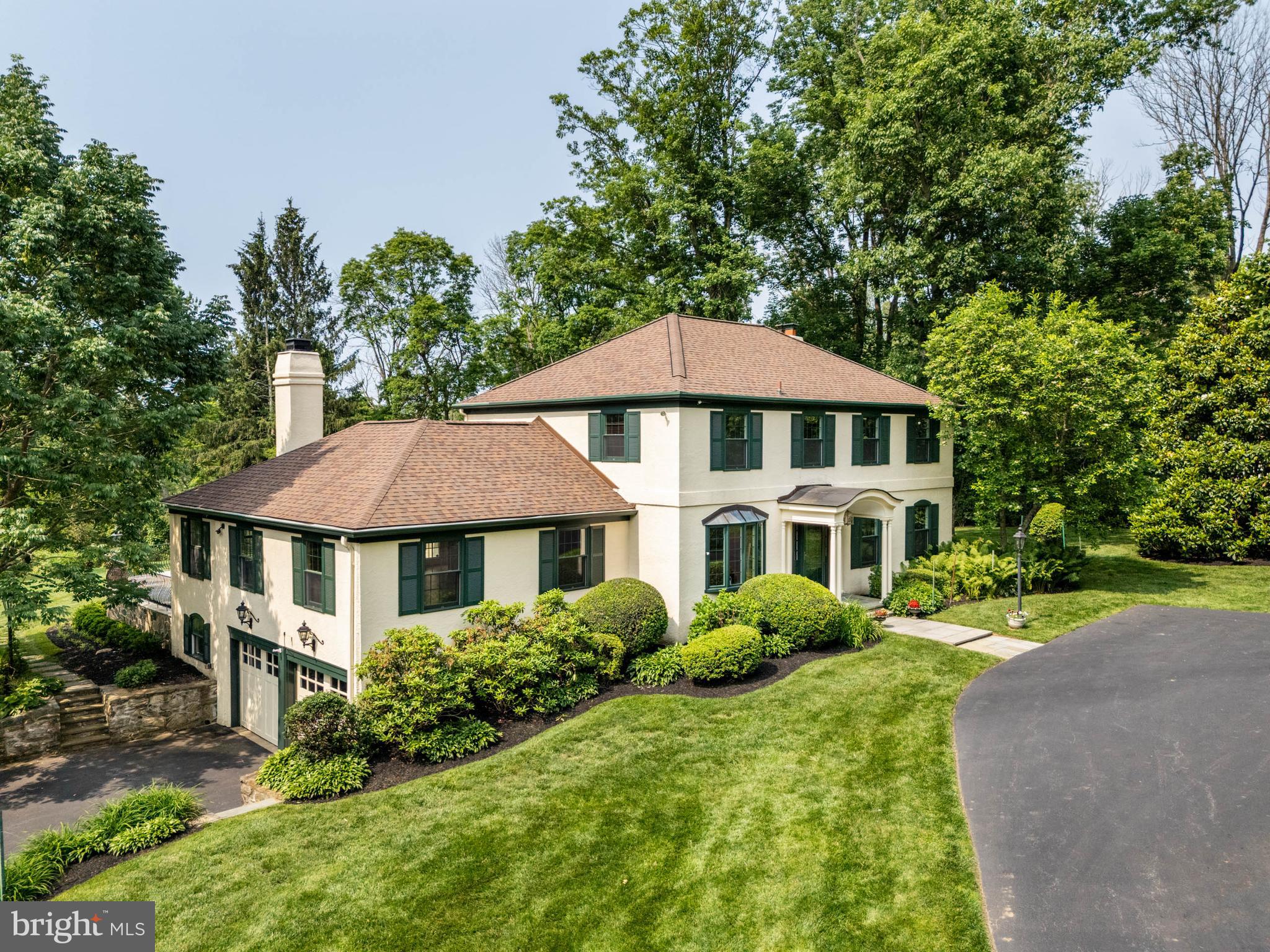 Nestled in the heart of Devon, Easttown Township, and set down a tree-lined drive on a bucolic, 2 acre parcel with breathtaking views of landscaped grounds that overlook the adjacent 170 acres of the Waterloo Mills Preserve, lies the special residence of 240 CHURCH ROAD. This classic, and well maintained, residence features 4 bedrooms | 3 full and 1 half bathrooms with a main floor bedroom ensuite - perfect for an au pair, visiting family, or multigenerational family living. Located in the award-winning Tredyffrin-Easttown School District, and convenient to Wayne, Devon, Berwyn and Newtown Square, you’ll enjoy easy access to top-rated schools, scenic parks, boutique shopping, vibrant dining and so much more. Designed for both everyday living and effortless entertainment, this home welcomes you and offers serenity, privacy and comfort. Upon entering the foyer, to your left is the well appointed office with elegant wainscotting, built-ins and a beautiful bow window providing natural light; and to your right, is the formal living room with built-ins and numerous windows providing natural light and views of the mature, landscaped grounds. Continuing down the hallway, the formal dining room is on your right, with beautiful wainscotting , crown molding, and a fireplace to set the perfect tone when entertaining. The kitchen is the central hub, perfectly placed between the Dining Room and the Great Room, offering spectacular views of the rear yard and easy access to the large, quartzite terrace, through French doors flanking the large Palladian window. Highlights of the kitchen include granite countertops, a breakfast bar, an eat-in dining area, an island with a bar sink, and a gas cooktop. Off to the right of the kitchen, lies a back hallway with additional access to the terrace, the powder room, the laundry room, and the Fourth bedroom ensuite. The convenient placement of this bedroom ensuite offers the flexibility for those needing space for an au pair, visiting family, or multigenerational living. This room has direct access to the terrace and provides scenic views. Adjacent to the kitchen, with easy communication between the living areas, is the Great Room. This large , flexible space features soaring ceilings with recessed lights, a wet bar area, and a wood-burning fireplace perfect for quiet family time, or be the favorite spot where family and friends watch all the big games! Whether entertaining, or sipping your morning coffee, you will surely enjoy many moments on the oversized terrace taking in the serene surroundings! The Second level features the primary bedroom with updated ensuite, bedroom 2, which was previously 2 bedrooms, now combined to make a larger bedroom, the updated hallway bathroom with double vanity, and bedroom 3. The basement is unfinished but offers a large area that could easily be finished as a recreation area, a cedar closet, a workshop area and foyer area with access to the expanded 2 car garage which offers tremendous storage. The house, septic system and the well were all pre-inspected. Enjoy additional security with the newer (2023) whole house generator for those inclement days. There is an on-site, buried 1,000 Gallon propane tank owned by the resident. Recent updates include new alarm system with new smoke detectors (2024), gas cooktop (2024), whole house generator (2023), refinished hardwood floors on main level (2021), 3 HVAC units with Wi Fi thermostats (2020), Roof (2020), 5 Nest outdoor security cameras (2020), hot water heater (2018), Well pump and water conditioning system (2017), Stone steps and walls (2017), Garage doors and openers (2016), and Pella windows (2014). Don’t miss this opportunity to make this home yours - schedule your private appointment today and you can be in before the school year starts! Showings begin Thursday, June 19th. Professional Interior photos to be uploaded Thursday, early Friday.