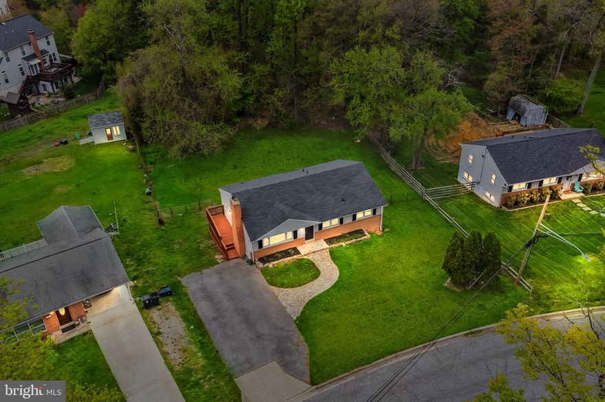 Welcome Home! Exquisite Brick Front Single-Family Home and this one has it all! Huge Driveway: Ample parking space for your convenience. Spacious Backyard: Perfect for year-round enjoyment and gatherings.
Deck: Ideal for outdoor relaxation and entertaining. Family Room: Cozy up by the fireplace in the family room. Dining Room: Hardwood floors add elegance to the dining area. Kitchen: Modern kitchen with granite countertops and stainless-steel appliances.  Basement: Includes a bedroom and a full bath, convenient for family and guests.  Recent upgrade: newer carpet. Location Benefits: Close proximity to shopping centers and highways. This house is ready for you to kick off your summer!