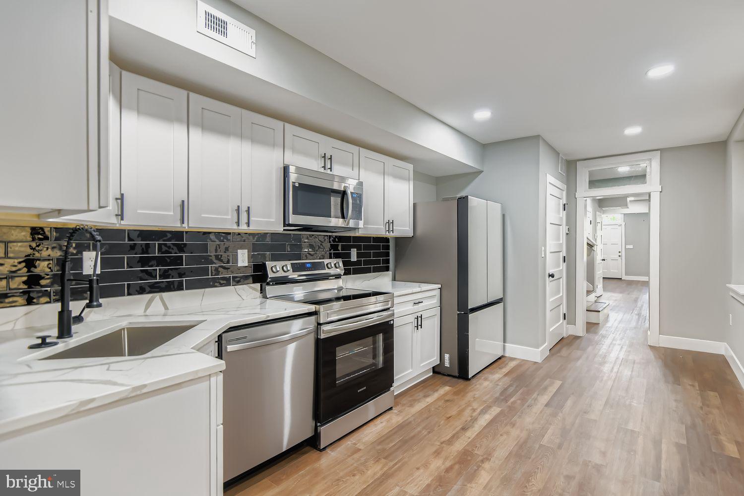 CHAP 10-Year Tax Credit – HUGE SAVINGS FOR BUYERS!!!
Welcome to 1409 E Eager Street, a fully renovated 4-bedroom, 4.5-bath townhome in the heart of Baltimore. This home comes with a 10-year CHAP tax credit, offering incredible long-term savings and making homeownership even more affordable.
Step inside to discover gleaming hardwood floors, designer finishes, a convenient half bath, and a laundry room on the main level. The gourmet kitchen features sleek white cabinets, a black subway tile backsplash, quartz countertops, and stainless steel appliances. Each of the four spacious bedrooms boasts its own en-suite bathroom, complete with custom tilework, matte black fixtures, and modern vanities. Enjoy the privacy of a fenced backyard, perfect for entertaining or relaxing outdoors.
Located near Johns Hopkins, Downtown Baltimore, and major commuter routes, this home combines modern comfort with city convenience.
Don’t miss your chance to own this stylish, move-in-ready home with significant tax savings. Schedule your private tour today!!!