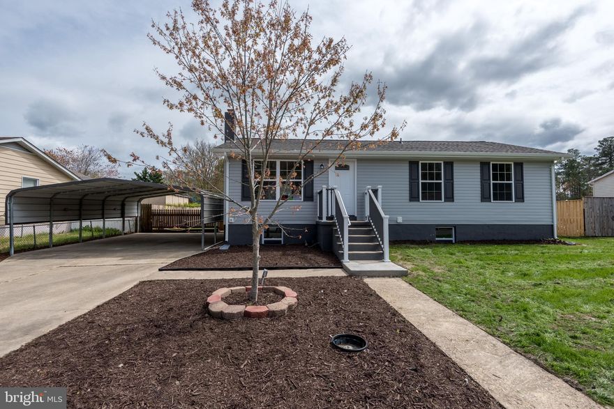 Completely renovated top to bottom with beautiful finishes by an experienced home builder! This home has all of the perks without the price! A clean, crisp and fresh budget-friendly home, this open concept one-story rambler features white kitchen cabinets, stainless steel appliances, beautiful lighting and luxury vinyl plank flooring throughout. Perfect for entertaining, the sliders off the dining room lead to a new deck overlooking the large, level, fully-fenced back yard. Expand your square footage later in the full unfinished basement with rough-in for a full bath, or use it for that always-needed storage space. Additionally, the systems are all new - HVAC and water heater, as well as installation of new windows, doors and siding. No well or septic worries, this home is fully serviced with public utilities. Unpack and relax at your new home on Knight!