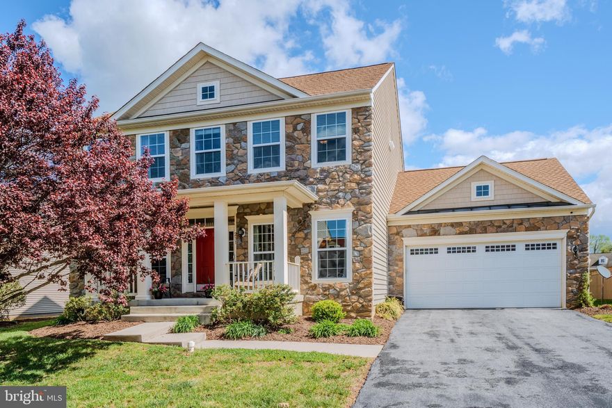 Open Saturday, April 25th, 12:00 noon to 2:00 p..m.    This is one gorgeous, welcoming and well-loved home in the quaint Town of Boyce!!!  Wow, it is sited on a beautiful lot on a non-through street in the community of Meadow View with a center green space as you enter!!!   The relaxing front porch with enjoyable southern views is only matched by the quiet patio in the private rear yard.   A gorgeous open entry foyer with wood floors and nine-foot ceilings has views into both the living room and dining room .... as well as the family room towards the rear.   Both the living room and dining room have two tall windows, crown molding and pillars to provide a bit of designer definition.  The dining room also has chair railings, wainscoting and a butlers pantry for your treasured dishes and special gatherings.   Your favorite kitchen .... with tall rich cabinets, stainless steel appliances, wood floors and a center island ..... that opens to both the breakfast area and family room ..... awaits you!!!  There are Bosch, Samsung, GE and Broan appliances, including a five-burner gas cooktop.   The breakfast area has recessed lights, wood floors and a sliding glass door to the patio.  The family room also has nine-foot ceilings, five light-filled windows and a gas fireplace with slate surround.   The switch-back staircase takes you to an awesome upper level with a large primary suite that includes a walk-in closet, a set of three windows overlooking the rear of the home, two additional windows, and a ceiling fan.  The sumptuous primary bath has a stunning Jacuzzi Brand soaking tub under a large window, two separate sinks with new mirrors and a separate shower with classic ceramic tile.   The additional bedrooms have walk-in closets, ceiling fans and have access to a generous secondary upper bath with dual sinks and a tub/shower with ceramic tile.   All of the quality open space of the top two levels is matched by the large open lower level with a recreation room big enough for media space, game rooms, crafts or even office space.   It has a sliding glass door with wide walk-up stairs to the private rear yard.   There is a FULL BATH on this lower level and lots of storage space.  The utility room has the new (2025) high-efficiency propane gas HVAC and a young nine-year old hot water heater.   The roof is also newer (2025) as is the the refrigerator and dishwasher (both 2025.)   The carpeting in the home is brand new.... having just been replaced.   This special fabulous home in a terrific community awaits!!!