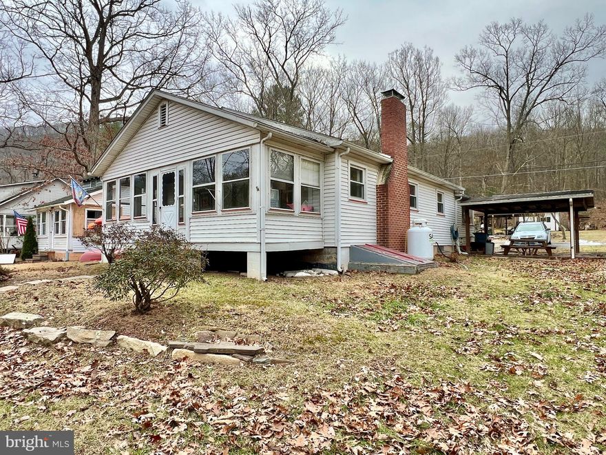 Hard-to-find cottage located along the Raystown Branch of the Juniata River! This cottage offers two bedrooms, one bath, living room with a gas fireplace, dining room, kitchen, laundry area, and an inviting enclosed porch overlooking the river. The seller has made several updates, such as a new oil-furnace, gas-fireplace, dishwasher, and water treatment system, and will be selling the property with some furniture and personal items. Outside you will find a double lot, pavilion, and detached garage/shop with a separate room with a six-person sauna. Located on a dead end road, this cottage makes a great place to kick back and enjoy the outdoors with friends and family.