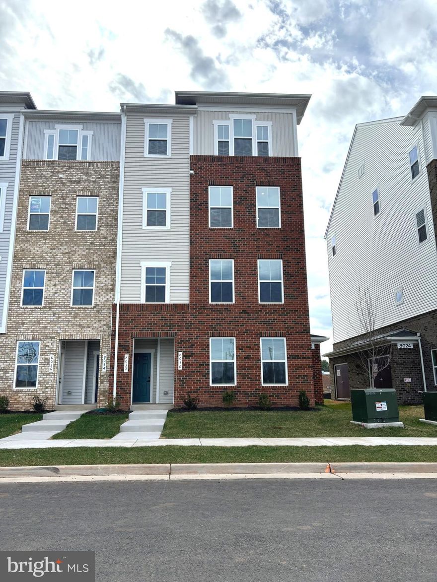 This beautiful brand new townhome style condo offers 3 bedrooms, 2.5 baths, a rear loading 1-car garage, and all the modern features and conveniences you could ask for! An open foyer welcomes you home and into a spacious great room where windows on two sides fill the space with natural light creating a light and airy atmosphere and highlighting warm wide plank flooring and a soft neutral color palette. The sparkling kitchen is sure to please with an abundance of pristine white cabinetry, upgraded quartz countertops, designer tile backsplash, and quality stainless steel appliances including a slide in gas range and French door refrigerator. A peninsula island provides bar style seating, while the open layout is perfect for spending time with family and friends and simple relaxation. Upstairs, the primary bedroom is your own private retreat boasting plush carpet, two walk-in closets, and a luxurious bath with a dual sink vanity, chic lighting and fixtures, and a glass enclosed shower. Two additional bright and cheerful bedrooms share easy access to the hall bath, while a laundry room with cabinet, sink, and washer and dryer on this level add convenience. No yard work required, and water is included! * Lomond Village boasts a convenient location in Manassas, close to some of the best shopping, dining, and recreation the area has to offer! * Direct access to Route 234, under 2 miles to I-66 * Walking distance to multiple shopping hubs like the Westgate Plaza Shopping Center with Panera, Cold Stone Creamery and Aldi, A Deli, Wingstop, Global Food and more! * .5 miles to Costco, Chick-fil-A, Starbucks, Giant Food, Marshalls, Ulta Beauty, PetSmart, Akasaka Sushi, Chili's and so much more at Bull Run Plaza. * 1 mile from Manassas Mall with Walmart Supercenter, Macy's, At Home, Uptown Alley Bowling, K1 Speed Autobahn, Floor & Decor, Dill Dinkers Pickleball * 3 miles to Old Town Manassas shops, restaurants, and VRE station * 10 minutes to Centreville * 15 minutes to Gainesville's Virginia Gateway shops and restaurants. It’s the perfect home in a stellar and convenient location!