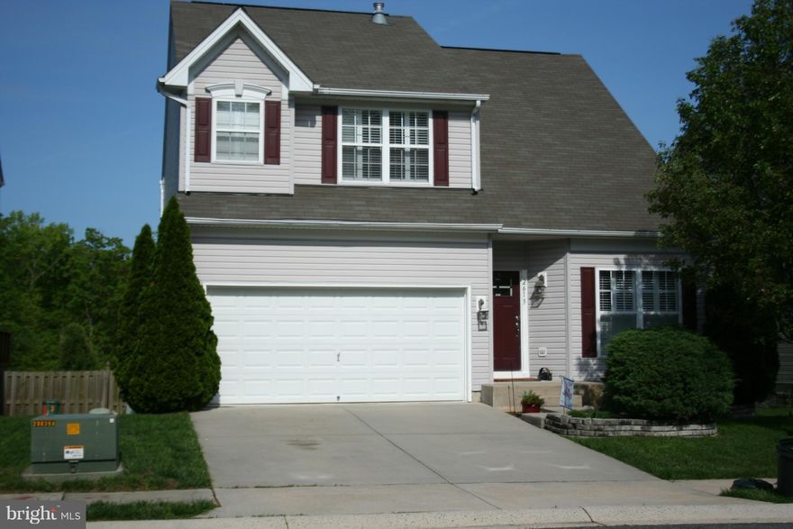 Beautiful home with 2-story ceilings and gas fireplace in Family Room. Stunning bamboo floors throughout main floor. New Plantation shutters, light fixtures and upstairs carpet. Kitchen features 42" cabinets, pantry and slider to deck! Separate Dining Room with built-in china cabinet. Cathedral ceilings in Master Bedroom.  Large Recreation Room with slider to patio and yard that backs to trees!!