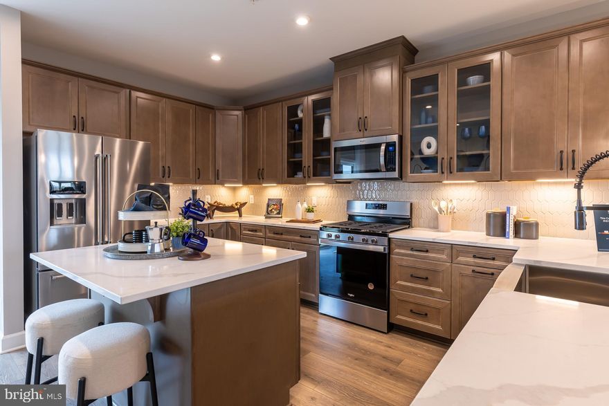Move-In Ready NOW!! The Potomac floorplan offers spacious living across three stories with a variety of
upgrades! This thoughtfully designed townhome features 3 bedrooms including a bright and open
primary suite featuring upgraded tile in the bathroom complete with a walk-in shower package. On the
bedroom level, enjoy a conveniently located laundry area and two generously sized secondary
bedrooms that provide space for family and guests with a full-size bathroom. On the main living level
with designer flooring throughout, you'll find an impressive open-concept kitchen with upgraded
cabinetry, countertops and backsplash elevating how you entertain that seamlessly connects the great
room and dining area. The attached 1-car garage opens to a recreation room completed with a powder
room. As a homeowner, enjoy community amenities, including the dog park, community playground,
pickleball and tennis court, and community gardens. Plus, enjoy access to Sparrows Point Country Club,
which includes a marina, boat ramp, newly renovated clubhouse with restaurant & bar, an 18-hole
championship-style course on Bear Creek, and the 2nd largest pool in Baltimore County. See your brand-
new home today. Enjoy energy savings with our ENERGY STAR® certified and Indoor airPLUS-qualified homes. *Photos are of the Model home. *Pricing, features, and availability subject to change
without notice.