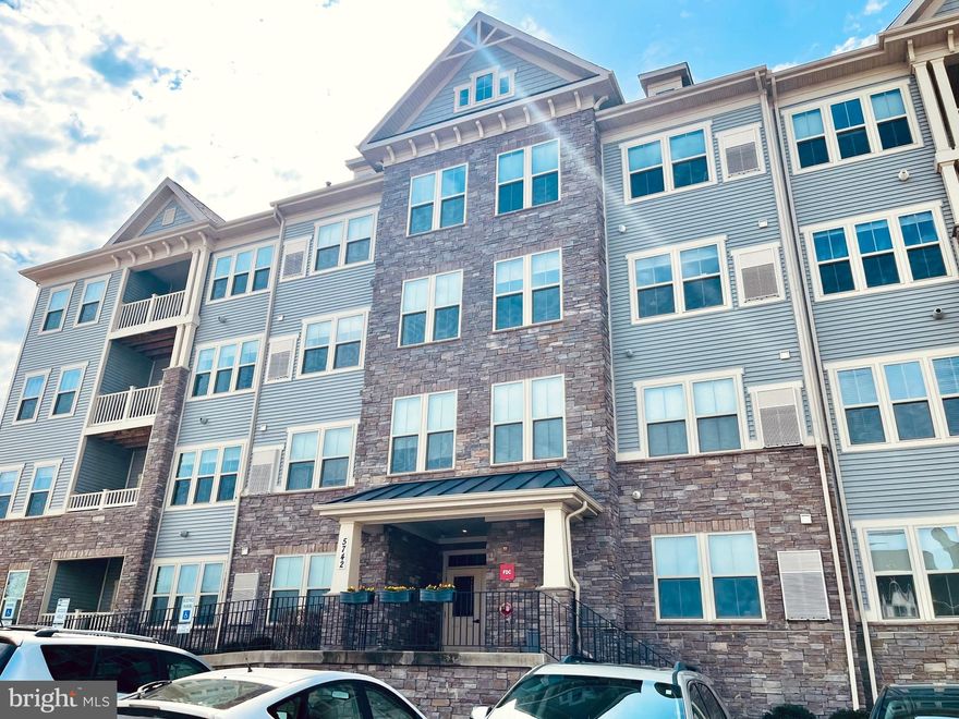 Welcome to this beautiful well maintained light filed spacious condo,  located in the  Lake Linganore Town Center community  with easy access to major routes and walking distance to the new  shops and  the highly rated Oakdale High School.  This home has  all the modern conveniences  such a secured building, elevator and all the all amenities that Lake Linganore offers in addition to being close to the beautiful  historic New Market town.  This spacious 1,456 SQFT  open floor home has 2 large bedrooms, 2 bathrooms,  laundry area, walking closets, gourmet kitchen, granite counters, breakfast bar, balcony, large defined spaces  for living and dinning room and plenty of storage. The condo fee includes the water bill and there is plenty of parking.