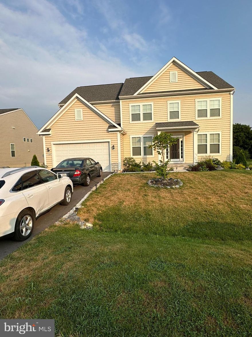 Beautiful Amazing Dream Home In Westfields in Hagerstown This is a stunning home build in 2023.  Open Modern style, with 5 bedrooms, 4.5 baths. Suburban Living at its best with easy access  access to major Metropolitan hubs Only an hour drive from the heart of the Nation’s Capital. This Vibrant community  is perfect for commuters and nature lovers.  This Home is elegant and thoughtfully designed. Two-story foyer, and unmatched Two Story Family Room with Floor to Ceiling  Natural Stone Fireplace is the true heart of the home.  The formal dining room is setting the stage for memorable dinner parties for family and friends.. The sun-drenched living room invites you to relax, while the expansive A stacked-stone fireplace creates a cozy yet sophisticated ambiance, perfect for quiet evenings or lively gatherings. The chef’s dream kitchen features GE stainless steel appliances, an oversized chef’s island ideal for meal prep and entertaining, and 42-inch solid wood cabinetry for ample storage. A  main level office room offers/ library, or even a first-floor bedroom is very convenient.  Ascend the grand staircase, and you’ll find a light-filled second level designed for comfort and luxury. A dramatic overlook floods the family room with natural light, creating an open and airy atmosphere.  Four spacious bedrooms and three full baths on the Upper level ensure plenty of space for family and guests. Centrally located laundry room on that level, provides convenience. The primary suite is a true retreat, featuring an elegant double-door entry, plush carpeting, and abundant natural light. The spa-like ensuite includes a two-person soaking tub, steam shower, and dual-sink vanity, creating a space of relaxation and comfort. With nearly 3500 square feet on two levels, this home has impressive, convenient and elegant layout.  Full finished Lower Level offers you large Family room with sliding door to walk on a level yard , on a premium Lot with no houses behind you. The additional large bedroom and a full bath,  all adds about 1,200 square feet of additional living space.  The Westfield community offers  amenities, for you and your family to enjoy living there. This includes scenic walking trails, tennis courts, and a community pool perfect for hot summer days.  The oversized two-car garage, and prime location, adds to this home functionality.