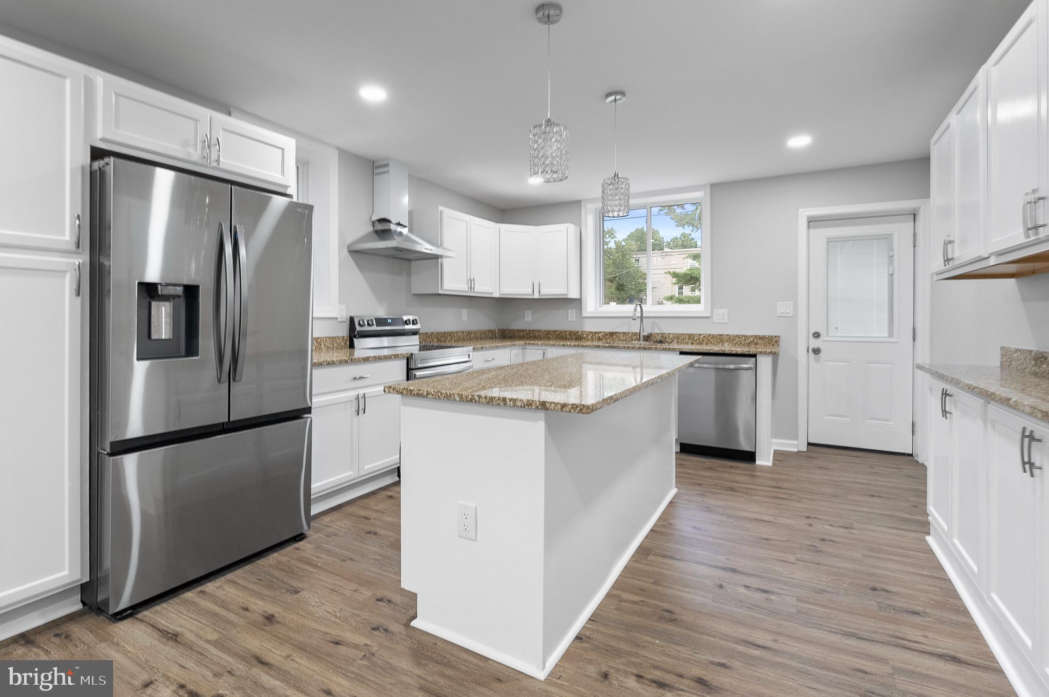 Every inch of this home has been beautifully updated—from new HVAC, plumbing, and electrical to polished hardwood floors and fresh paint. The open-concept living and dining area is filled with natural light and perfect for entertaining. The kitchen features stainless steel appliances, quartz countertops, shaker cabinets, a tile backsplash, and a center island. Step outside to a covered front porch and fenced backyard patio. A full basement offers laundry, storage, and workspace. With a new roof, siding, windows, and more—this home is move-in ready and low maintenance. Located near shops, dining, parks, and major routes for easy access throughout Maryland and Pennsylvania.