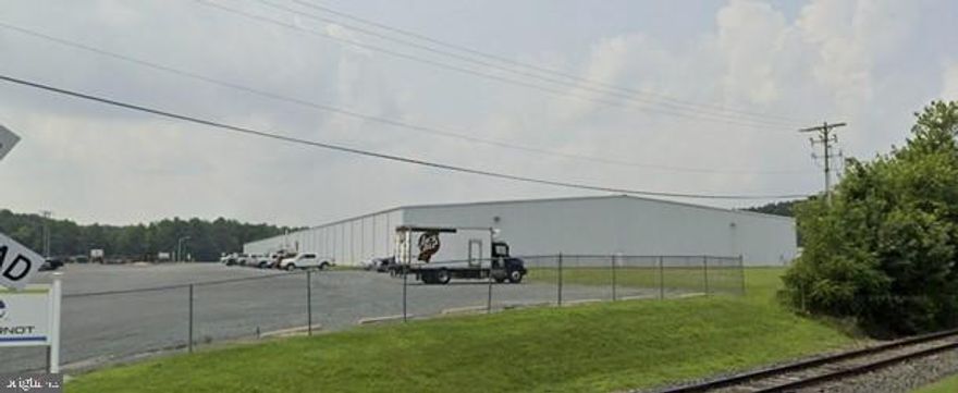 178,000 square foot industrial facility on 15.40 acres.    Ceiling height is 31' at center and 24' at eaves.   16 - 10 x 10 docks (3 pits)  and 2 drive-in doors.   Fully sprinklered with a dry system.  Very flexible layout for single or multiple users.    Several office areas with heat, a/c and restrooms.   Zoned ID2-General Industrial.  

    Situated in the Caroline Industrial Park with access to major transportation routes, including Highways 318 and 404.  This park is equipped with electricity, natural gas, water and sewer, broadband internet access, paved roads and fire and police protection.  Strategic location for distribution and logistics. 

The region is also home to a skilled workforce and a supportive business environment. 

Currently 40% occupied (owner will be vacating the balance).