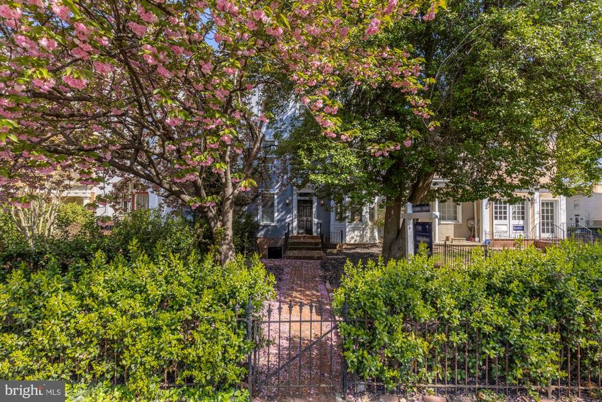 Positioned on the coveted 200 block of East Capitol Street, just steps from the Supreme Court and the grounds of the U.S. Capitol, this exceptional residence offers a rare opportunity to own a piece of Washington’s earliest residential history.  The perfect place to entertain your most important guests with meetings and fundraisers.  With origins believed to date to the pre–Civil War era, the building stands among Capitol Hill’s earliest surviving structures—offering a distinctive blend of architectural heritage and modern-day potential.

Spanning nearly 4,500 square feet, the property is currently configured as two units, providing immediate flexibility for a range of commercial or institutional uses. The existing layout—featuring a lower-level two-bedroom, two-bathroom unit and an expansive upper-level residence with eight bedrooms and four bathrooms—lends itself seamlessly to conversion into office suites, meeting spaces, or a unified headquarters environment.

This property is exceptionally well-suited for organizations seeking a prominent Capitol Hill presence, including law firms, consulting groups, nonprofit organizations, associations, think tanks, or diplomatic and policy-focused entities. Its scale allows for private offices, conference rooms, collaborative workspaces, and executive areas, while maintaining the character and distinction of a historic setting. Renderings are available illustrating the potential transformation into a refined office or group-use environment, providing a clear vision for repositioning the asset to meet modern operational needs.

Architectural details such as hardwood floors, two fireplaces, and preserved period elements—including substantial masonry and original proportions—create a unique and elevated atmosphere rarely found in traditional office inventory. A circular staircase leading to the roof offers the potential for additional breakout or amenity space, while the rear parking pad accommodating four or more vehicles provides a critical convenience for staff and visitors alike.

Surrounded by some of the nation’s most influential institutions—including the Supreme Court, Library of Congress, and the U.S. Capitol—this location offers unmatched proximity to the center of government and policy. East Capitol Street is widely regarded as one of Washington’s most prominent and ceremonial avenues, long associated with leadership, influence, and historic prestige.

Combining irreplaceable location, significant scale, and adaptive reuse potential, this property represents a compelling opportunity for an owner-user, investor, or institution seeking to establish a presence in one of Washington’s most iconic and historically rich settings.