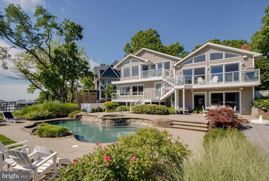 Enjoy sunrise views over Duvall Creek from this gorgeous home just minutes from downtown Annapolis.  Walls of windows, bright open kitchen, vaulted ceilings, main level master, newly renovated master bath 2 family rooms and stone hearth fireplace. Entertain by the waterfront pool and hot tub.  Private pier with 2 jet ski lifts and 2 boat lifts. Priced below appraised value