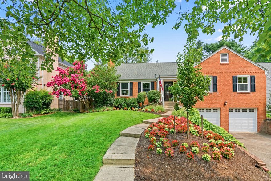 Set in Bethesda's sought-after Springfield community, this stunning 2,476+ sqft brick colonial is quietly situated on a pristine .27 acre homesite highlighting professional landscaping and a covered front porch entrance. Inside this well-designed residence you find style and casual comfort ideal for entertaining and easy day to day living featuring fresh interiors, a hardwood foyer greeting you upon arrival, profile crown moldings, enriched hardwoods, a generous living room centered by an ambient wood burning fireplace surrounded by built-ins, and an open dining room with double French doors stepping to a brilliant sunroom. Enjoy entertaining as you prepare your favorite gourmet meals in the eat-in kitchen equipped with GE Café® appliances, 42" raised frame and glass white cabinetry, chevron style backsplash, quartzite counters, a peninsula island breakfast bar, and a convenient walkout to a sunroom with a painted wood ceiling, a lighted ceiling fan, and a walkout to a composite deck and verdant backyard. On the very top level is a 12x13 floored attic bedroom with a cathedral ceiling and separate wall mounted heat and air system, plus a side for storage, while 3 additional bedrooms are located on the main level including an owner’s suite presenting a walk-in closet, lovely hardwoods, and a private bath. Exceptional living spaces continue in the lower level complete with a game room, a rec room made comfortable by a wood burning fireplace, a half bath, and a walk-up to a lush backyard perfect for parties and barbecues.