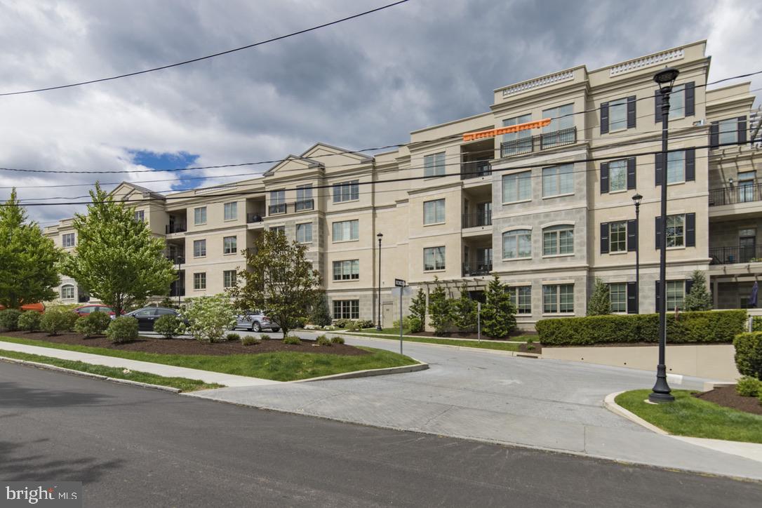 Here is your chance to buy in this rarely offered and highly sought-after building in the heart of the Main Line. Located on a quiet, peaceful street, 100 St. Georges Rd offers the excitement of city living with the leisurely pace of a close-knit neighborhood. Located just steps away from Suburban Square; and a short walk to downtown Ardmore for additional shops and restaurants, and to the regional AMTRAK and SEPTA rail, providing direct service to Philadelphia and NYC. As you enter this home, you are greeted by a beautiful foyer with an oversized coat closet. Then step into a sun-filled family room with 10-foot ceilings, a gas fireplace, built-in bookcases and beautiful hardwood floors. There is plenty of room for entertaining in the dining area as well as a large, private patio. Additional trees have been put around the patio for landscaping and additional privacy. The spacious chef’s kitchen features substantial counterspace including a large island and beautiful Bosch and SubZero appliances. Right next to the kitchen is a spacious laundry/utility room. The master suite features a large walk-in closet and a large master bathroom with soaking tub and shower. This unit has 2 additional bedrooms with an abundance of closet space. One bedroom has a bedroom with a full bathroom, the second bedroom has a full bathroom across the hall. The unit has 3 bedrooms and 3 full bathrooms. Additional features include: custom interior millwork, Pella windows, wood shutters, high efficiency HVAC, sprinkler and security systems and an underground garage with 2 assigned parking spots plus a large individual storage room.