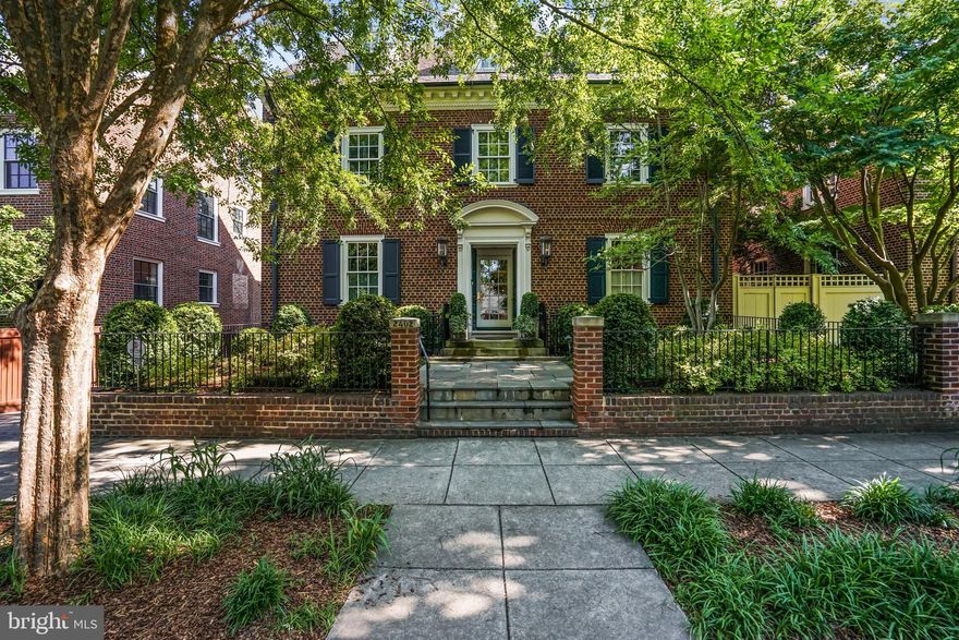 Showings by appointment, Buyer registration required.  

Sited on one of Kalorama's most prestigious blocks with botanical-lined streets and Historic Wardman architecture, this exquisite Federal Colonial will leave you spellbound as historic personality mingles with bespoke design.  Built in 1922, this shaded, brick-wrapped home welcomes with a prim and proper facade, while inside, 5,130 square feet are a multi-sensory delight as maximalist old-Floridian charm takes center stage, reminiscent of the Kips Bay showhouse. Throughout four floors of superbly renovated living vistas, explore to find chocolate-hued hardwoods, show-stopping checkered tile, cozy fireplaces, polished hardware, and endless built-ins.  Sunlight soars in from the dining room wall of floor-to-ceiling windows and French doors, while ceilings and interior walls are lined with luxurious papers from Gucci, Fornasetti, and Brunschwig & Fils.

Display conversation-sparking treasures in the living room, unwind-away Sundays within your restful library, invite friends for film screenings in the media room and escape to the walk-out basement where your “room with a view” features floor-to-ceiling windows and artful studio lights. In the posh chef's kitchen, complete with high-end appliances, pack picnics for strolls to local parks and fill the home with the savory aromas of favorite heirloom recipes. Serve dinner in the cupboard-clad dining room or dine al fresco where two distinguished patios dot manicured gardens shaded by blossoming trees. Here, host Summer fundraisers with wine paired with the sounds of the city, or simply enjoy spring breezes after Embassy cultural events. Five bedrooms plus three and two half baths envelop guests with care and style. Complete chores in a playful laundry room, screen films in the theater, then escape to the primary suite where the sitting room and marble bathroom are warmed by private firelight. A slice of textured, bold, and joy-filled heaven amongst neighboring jewels, Kalorama is a singular peaceful refuge for diplomats, ambassadors, and ex-presidents. From home, Rock Creek Park, favorite shops, and eateries entertain, while the Georgetown Waterfront, electric Dupont, and downtown Washington DC await.