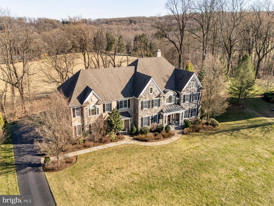 Welcome to 6 Ashwood Lane—a grand yet inviting  home in a lovely Charlestown Township neighborhood, offering breathtaking views of 15 acres of open space and more than 7,700 above-ground sq. feet of meticulously maintained living space. 

Step into the stunning two-story foyer, where natural light and timeless elegance set the tone for this exceptional residence. The chef’s kitchen is designed for both function and style, featuring a Sub-Zero refrigerator and freezer, Thermador oven and gas range, an additional Thermador wall oven with a warming drawer, and Bosch dishwasher. The adjacent family room, with ventless gas fireplace, and breakfast area provide a warm, inviting space perfect for casual gatherings. While an elevator ensures effortless access to all levels.

The living room is a serene retreat with sweeping views of the open space and offers a wood burning fireplace. The elegant dining room is ideal for special occasions, with refined details and ample space for entertaining. The first floor also has two powder rooms, a large office and a bonus room. 

Upstairs, you’ll find five generous bedrooms, each with a walk-in closet and private bathroom. The primary suite is a luxurious escape, featuring an expansive walk-in closet and a spa-like bathroom with heated marble floors, jetted tub, and large rimless glass shower. On this floor you will find the laundry room and another bonus room that provides flexible space for studying, TV watching, or crafts.

The expansive walk-out basement offers endless possibilities—whether a home theater, gym, bedroom suite, or entertainment space. A whole-house 20,000 KW automatic generator ensures year-round comfort and peace of mind. Beautiful solid oak hardwood floors are throughout most of the home. 

Outside boasts a beautiful blue stone patio, fireplace, gourmet grill, lush landscaping and privacy all while overlooking the bucolic rolling hills of Chester County.  

Set in one of Malvern’s most sought-after locations, this home is a rare opportunity. Schedule your private tour today!