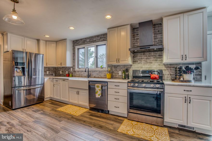 Welcome Home to 1307 Pinch Valley Road. Enjoy the modern convenience of being close to shops, restaurants and bars while also feeling like you are tucked away in your own private rural setting. This 4 bed, 3.5 bath  property sits on 1.76 acres of land and has everything a homeowner could want! Nearly 60K of upgrades have been made to this home. Upgrades include: Completely renovated modern open-concept farmhouse style kitchen / dining area that could be in a magazine! Remodeled half bath, gas range, dishwasher, refrigerator, wine fridge, countertops, cabinets, porcelain "wood" tile floors throughout, water heater, paint, wood burning insert with blower in living room, and privacy fence. The large master bedroom sits on the main floor, complete with an en-suite bathroom (separate bath / shower), walk-in closet, functional wood burning fireplace, and spiral staircase leading up to the loft area. On the upper level you will find 2 large bedrooms, an office space (with potential to convert into a bedroom), tons of storage and one full bath complete with a beautiful skylight. The basement is incredibly spacious and includes sliding glass doors that lead to the backyard, stove insert, separate washer & dryer area, utility room, central vacuum, an additional bedroom and a full bath.  HVACS / Water Heaters  have all been replaced within the past 4-5 years. The only thing you will need to do is move in!