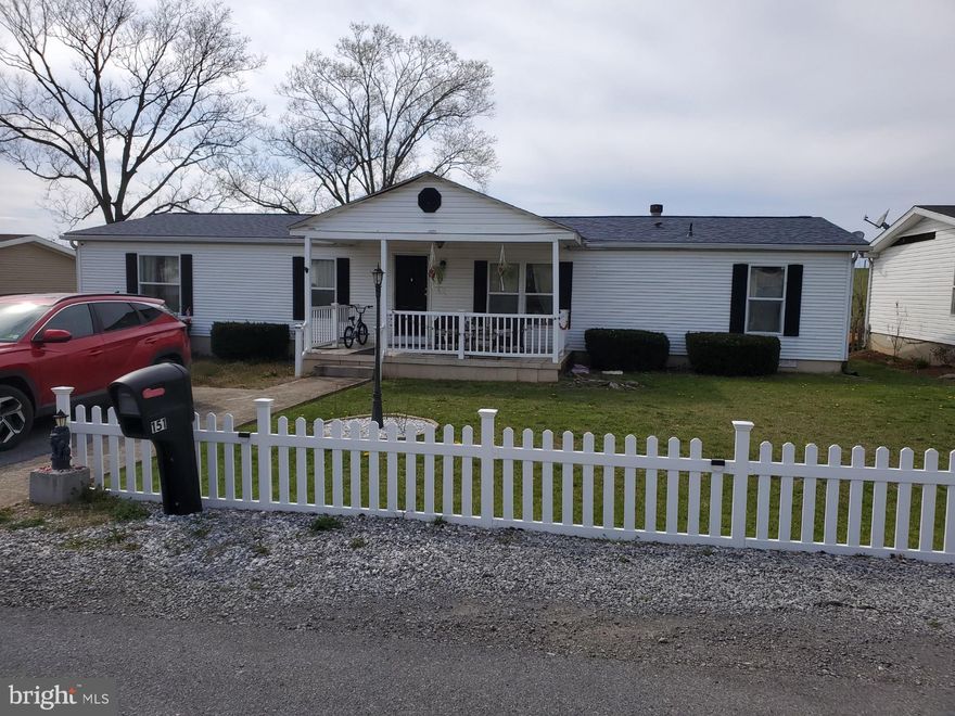 <CONTRACT PENDING SIGNATURES>  Gorgeous 3 Bedroom 2 Full Bath manufactured Rancher on permanent foundation with over 1600 square feet of one-level living.  Great home for 1st time homebuyer or retiree.  Home was recently renovated with fresh paint from top to bottom, new luxury vinyl plank and carpet flooring throughout, new stainless steal appliances and new brushed nickel hardware and fixatures.  The included pellet stove will take the chill out of those cold winter days & nights.  Enjoy the covered front porch or fenced-in rear yard. Great location close to schools, shopping, restaurants and medical facilities.  LOADED w/ upgrades! You have got to see inside this one to believe it!   Open floorplan, large kitchen w/ island, oak cabinets, open family room and dining room with beautiful stone mantel/fireplace, stained trim throughout, built in shelving, vaulted ceilings.  New roof in 2021.  New hot water heater in 2022.  Seller has recently installed privacy curtains on the front porch to create a cozy outdoor cabana!   Sure to go fast! Don't miss this one.  We can recommend a lender that can accept a manufactured home if needed.  Call with questions!