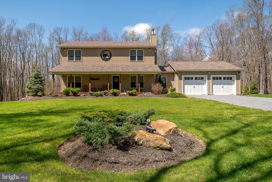 4/5BR 3BA custom home (3900+ total sf!) on 8+ acres of peaceful tranquility! Conveys with 2 lots (6 & 7) totaling 8.05 acres of wooded land in a laid back HOA that allows chickens & embraces the outdoor amenities Garrett County offers. Private and secluded rural location that is just minutes from town, schools, shopping and dining. This home was custom designed for work from home professionals - specifically 2 offices on the main level that could serve as quiet nooks or study space or be re-worked into a much larger bedroom, if preferred. Owners have spared no expense to install high-end features to provide peace of mind - multiple high speed internet options (Fios now in neighborhood), Generac backup generator, tankless hot water, whole-house water filtration system, 1,000 gallon propane tank (owned), wired exterior cameras, additional storage building/shed, attic storage in garage, upgraded fire sprinkler system and a basement that offers unlimited expansion potential, along with a roughed-in extra bathroom.  The house stills feels brand new with a finished garage, fantastic mudroom, wood burning fireplace, spacious eat-in kitchen with granite, custom cabinets, high end appliances + trash compactor, whole house LVP, oak stairs, 3 zone furnace and a walk-out basement. Outside, enjoy a covered front porch, a massive back deck with automatic Sunsetter retractable awning. Add in a dream lawn with mature trees and mountain views to seal the deal. If you are looking for adventure, you can ride your street legal UTV/side by side a few short miles to Wolf Den Run State Park and Huckleberry Rocks for 50+ miles of ORV trail riding, spread over 2,000 acres. Hunting, fishing, hiking, swimming and boating - all offered nearby via Potomac State Forest, Lost Land Run, Jennings Randolph lake and Deep Creek Lake. Nearly 20,000 acres of state land, trails, multiple state parks and epic adventure are at your disposal but you may never want to leave after you see this gem!