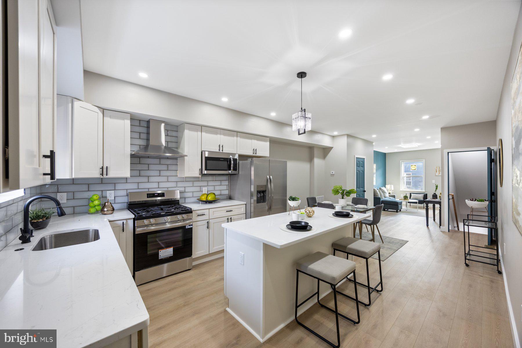 Beautifully renovated and move-in ready 3BR/2.5BA townhome located in Remington! Make your way to the front door and step into a home with tons of natural light, luxury plank flooring, recessed lighting, and a freshly painted interior featuring a soft color palette with warm accents throughout. The main floor living space is the open concept floor plan homeowners are seeking featuring a spacious living room, large dining room, a half bath, and glamorous kitchen. The kitchen boasts plenty of cabinets to the ceiling, stainless steel appliances, sleek quartz countertops with a beautifully tiled backsplash, a stainless sink under a window, and an island with pendant lights and breakfast seating. On the second floor are two sizable secondary bedrooms, a spacious primary bedroom, and a newly renovated full bath. The lower level offers functional finished living space featuring an additional fourth bedroom and full bath with a walk-in shower, laundry and plenty of storage. All bathrooms are designed with LED mirrors and each full bathroom is equipped with built in bluetooth speakers. From the kitchen step outside to a fenced yard with a large patio and so many possibilities. This home has been completely renovated including new windows, electric water heater and so much more. Imagine all this and in close proximity to shopping, and commuter routes.