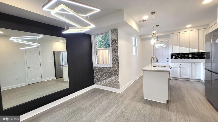 Gorgeous semi-detached home featuring exquisite modern customization's and a spacious open-concept layout perfect for entertaining and everyday living. This beautifully renovated property offers 4 bedrooms and 3.5 bathrooms, including a stunning primary suite and spa-inspired bathrooms designed for comfort and style.

Enjoy a fully finished lower level with an open entertainment space & additional separated room & bathroom that walks out to your private deck overlooking a fully fenced backyard—ideal for relaxing, hosting, or pets.

Located in the desirable Forest Park neighborhood, this home truly has it all! 
Furniture pictures are virtually staged but the gorgeous home designs are real!