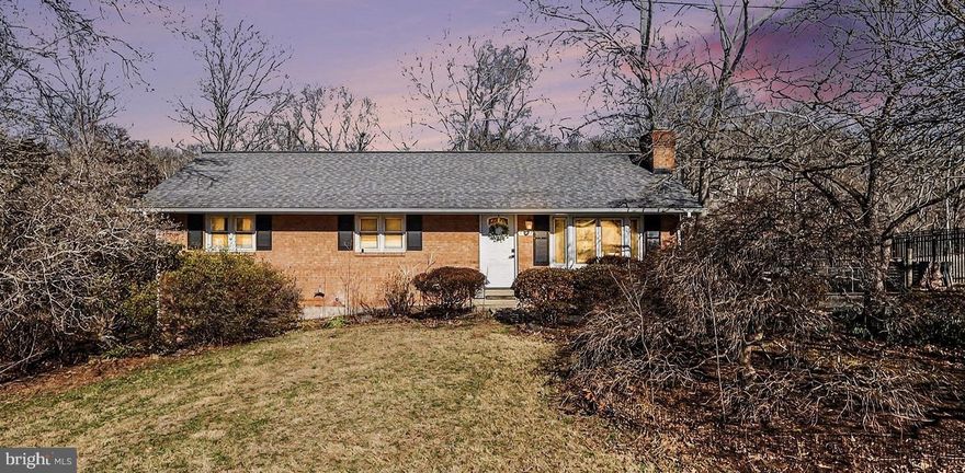 OPEN HOUSE SATURDAY 1-3pm. Rare opportunity to own over 1 acre on Bull Run waterfront with direct access to miles of recreation. Enjoy kayaking, canoeing, tubing, fishing, and hiking right from your backyard, with the river leading into the Occoquan. Directly across the water is protected Fairfax County parkland with over 20 miles of wooded trails, ensuring privacy and no future development.

The property offers a blend of maintained yard and natural landscape. Part of the backyard is fenced and landscaped with garden beds, while the remainder features young trees and a trail leading down to the water. The entire acre can also be maintained as open lawn if desired.

 The main level features an open-concept layout with living, dining, and kitchen areas, hardwood flooring throughout, three bedrooms, and a full bath. Sliding doors from the dining area open to a deck overlooking the woods and river.

The walk-out basement was remodeled in 2018 and includes waterproof luxury vinyl flooring, a large recreation area, workshop, bedroom, additional NTC bedroom, and full bathroom. The basement addition includes a kitchenette, laundry area with granite countertops, and a custom dog wash station, creating an ideal in-law or rental setup. This section of the basement has a separate HVAC system installed in 2021 and is currently being utilized as a Mother-In-Law suite. 

Additional updates include a roof replacement in 2015. Located in a quiet neighborhood with minimal through traffic, the setting is peaceful with surrounding woods and river views.

Conveniently located off Route 28 in northern Prince William County near the Fairfax County line, approximately 4 miles to I-66 and the new interchange.

Note: The property is located in a designated flood zone, so lenders will typically require flood insurance (currently approximately $4,000 annually). The home itself has not experienced flooding.