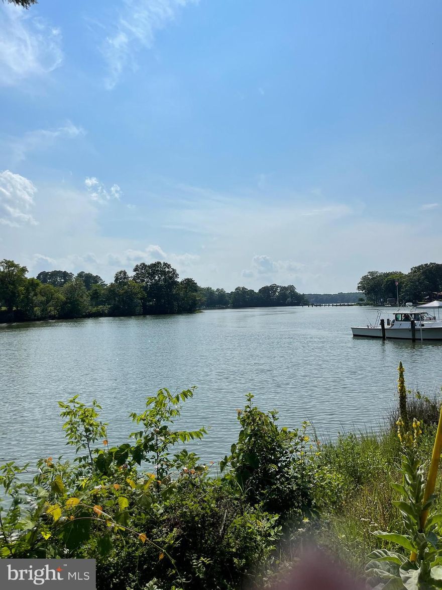 Nestled in a serene and picturesque setting just south of St. Mary City, this open floor plan one-bedroom, one-bath apartment above a garage offers a tranquil oasis with convenient water access. The spacious living area seamlessly flows into a naturally lit kitchen, creating a warm and inviting atmosphere. Large windows provide breathtaking views of the surrounding natural beauty, perfect for nature enthusiasts and those seeking a peaceful escape. With water access, residents can enjoy leisurely kayaking adventures or simply bask in the tranquility of the waterfront. Its location offers the best of both worlds - a serene retreat combined with easy access to amenities and a straightforward commute to Webster Field and Patuxent River Naval Air Station. This charming apartment promises a harmonious blend of relaxation and convenience, making it an ideal haven for those seeking solace and natural beauty.