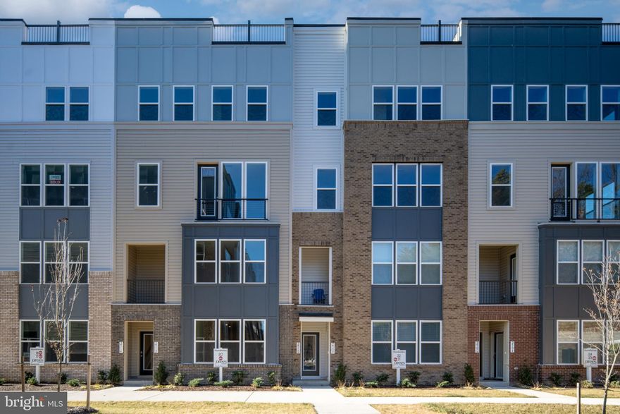 Experience Modern Living with Classic Mid‑Century Style**

Step into this stunning mid‑century townhome‑style condominium offering 3 spacious bedrooms, 2.5 baths, and a rooftop terrace with picturesque, tree‑lined views. Designed for those who appreciate both style and function, this home blends sleek modern aesthetics with warm, inviting details.

The open‑concept living, dining, and office areas are drenched in natural light, creating an ideal setting for both relaxed everyday living and vibrant entertaining. At the heart of the home, the gourmet kitchen showcases the Mid‑Century Design Collection, complete with honey‑rye cabinetry, a quartz island, and stainless‑steel Whirlpool appliances—perfect for the aspiring chef.

Step outside to the expansive terrace, where a cozy fireplace sets the tone for memorable evenings of outdoor dining and unwinding.

Upstairs, a spacious loft offers endless possibilities—media space, playroom, or creative studio—alongside three generous bedrooms. The luxurious primary suite features a walk‑in closet and serene atmosphere, while the upper‑level laundry and double‑sink hall bath add thoughtful convenience.

This is modern living at its best—stylish, functional, and designed to elevate your everyday experience.