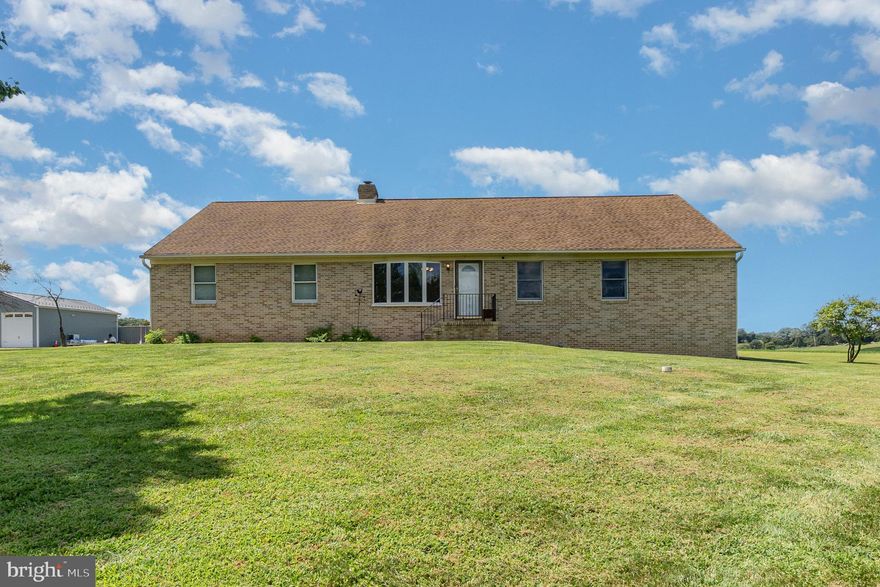 Discover the perfect blend of comfort, space, and scenery in this inviting 2-bedroom, 2-bath rancher nestled on over 2 acres of land surrounded by peaceful farmland views. This home offers the ideal setting for those seeking a quiet retreat with plenty of room to spread out.  Step inside to find a warm and functional layout with living areas that flow effortlessly for everyday living. The heart of the home offers a cozy and welcoming atmosphere, while the bedrooms provide restful spaces filled with natural light.  Primary bedroom and primary bath are very spacious, along with a large walk in closet.  A standout feature of this property is the newly finished basement, thoughtfully designed to create additional living space that’s perfect for a family room, recreation area, or even a home office or 3rd bedroom.  Car enthusiasts and hobbyists will appreciate the oversized 2-car garage, offering ample space not only for vehicles but also for storage, tools, and projects.  Stairs in the garage lead you to a bonus room above the garage!   Outdoors, the expansive lot is a true highlight—whether you’re envisioning gardens, outdoor entertaining areas, or simply enjoying the rolling farmland scenery and beautiful sunsets, there’s room to bring your dreams to life.  Combining the ease of single-level living with modern updates and abundant outdoor space, this property is a rare find. If you’re looking for a home that delivers both charm and practicality in a tranquil country setting, this rancher is the perfect match.