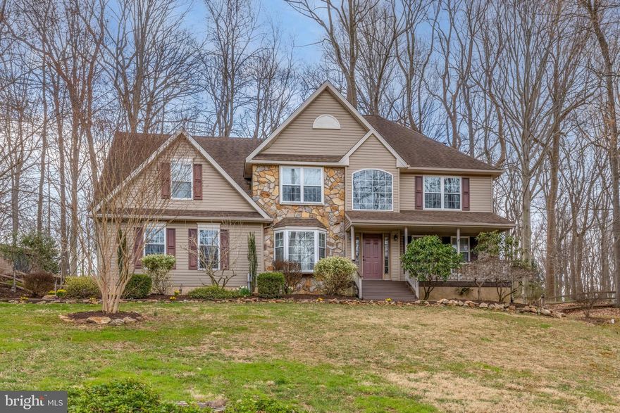 Welcome home to your new wooded retreat tucked away on a quiet cul-de-sac in the sought after Quail Hill neighborhood. Relax after a long day on the covered front porch, or retreat to the peaceful back yard with expansive deck featuring scenic wooded views. Impressive 2 story foyer leads to the first floor office with built-in shelving & stylish wood accent wall. Dining room offers plenty of natural light, crown molding, chair rail and a huge bay window. The open kitchen features an abundance of cabinetry, hardwood floor, tile backsplash and leads to breakfast room with another bay window and more custom built-ins. The kitchen opens to the two story family room with palladian window and handsome stone fireplace. The main level laundry room offers cabinets, laundry sink & access to the rear deck. Ascend the steps to the second floor where you’ll find the spacious primary bedroom suite with sitting area, walk-in closet and full bath with tile floor & tile shower. The second level is completed by 3 more generously sized bedrooms and an updated hall bath. Other features you’ll enjoy include hardwoods throughout most of the first floor, side-entry two-car garage, EV charger & whole house generator panel.