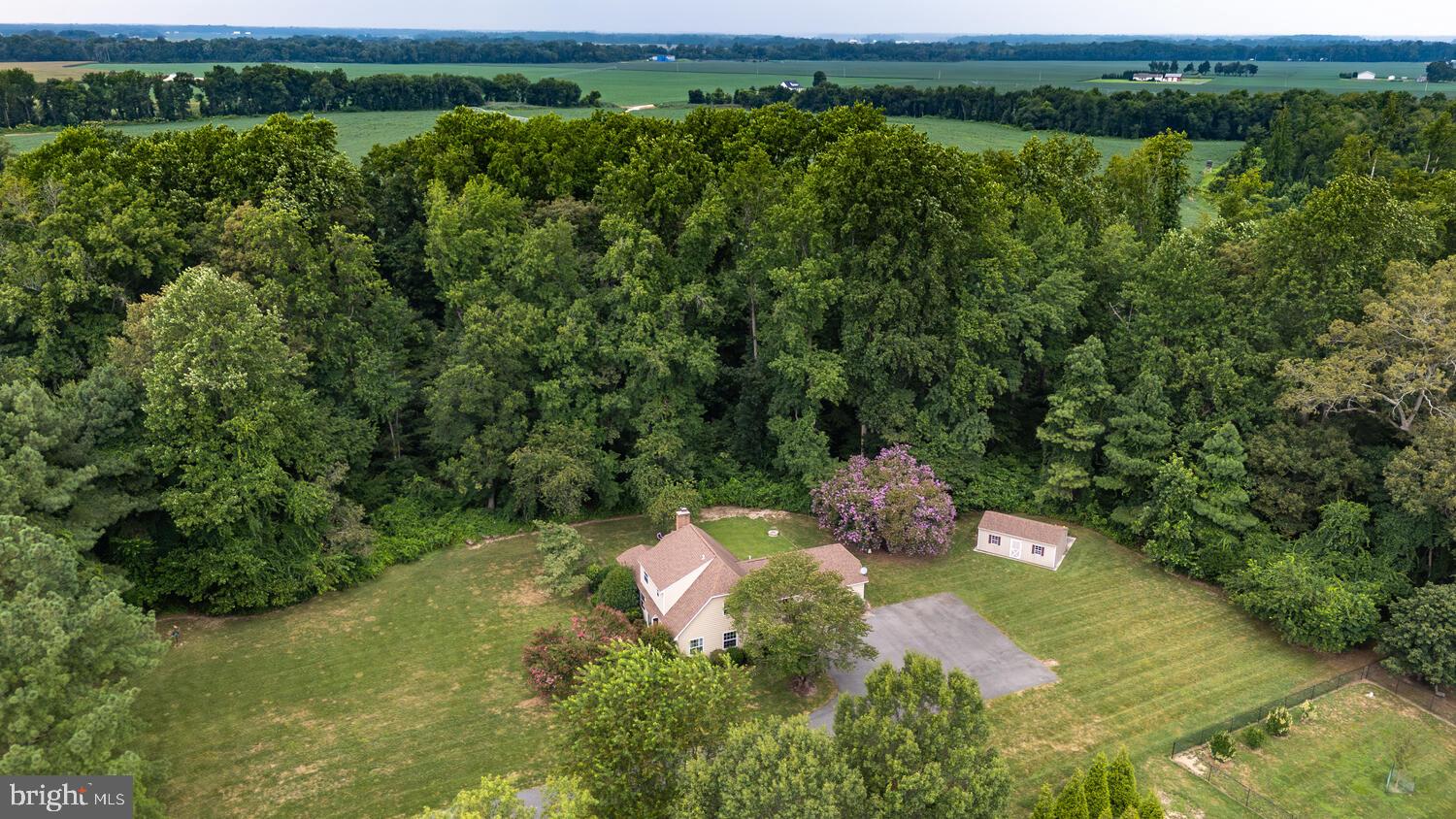 Discover a rare gem on Maryland’s Eastern Shore—this stunning contemporary home is nestled at the end of a quiet cul-de-sac, offering the perfect combination of peaceful living and modern elegance. Set on over 4 beautifully manicured acres, the property boasts a park-like setting that provides serenity and privacy while still being close to the area’s charming towns and natural beauty. With 4 bedrooms and 3.5 bathrooms, this home offers a warm, inviting floor plan that flows effortlessly from one room to the next. The spacious living room features a cozy fireplace, perfect for relaxing evenings, while the gorgeous sunroom invites you to soak in natural light and enjoy panoramic views of the surrounding landscape year-round.
The first-floor primary suite adds convenience and comfort, while the upper-level bedrooms offer ample space for family and guests. Recent improvements elevate this home to turn-key status, including new carpet, beautiful granite countertops and new cabinetry in the kitchen, gleaming hardwood floors, a newer deck ideal for entertaining, updated windows and siding, and a paved driveway that adds curb appeal and function. Additional highlights include remodeled upstairs bathroom and a new shed for extra storage.
Whether you’re savoring quiet mornings in the sunroom, hosting friends on the deck, or simply enjoying the tranquility of the mature trees and expansive lawn, this home offers a lifestyle of comfort, beauty, and ease. Located in the Chapel School District.