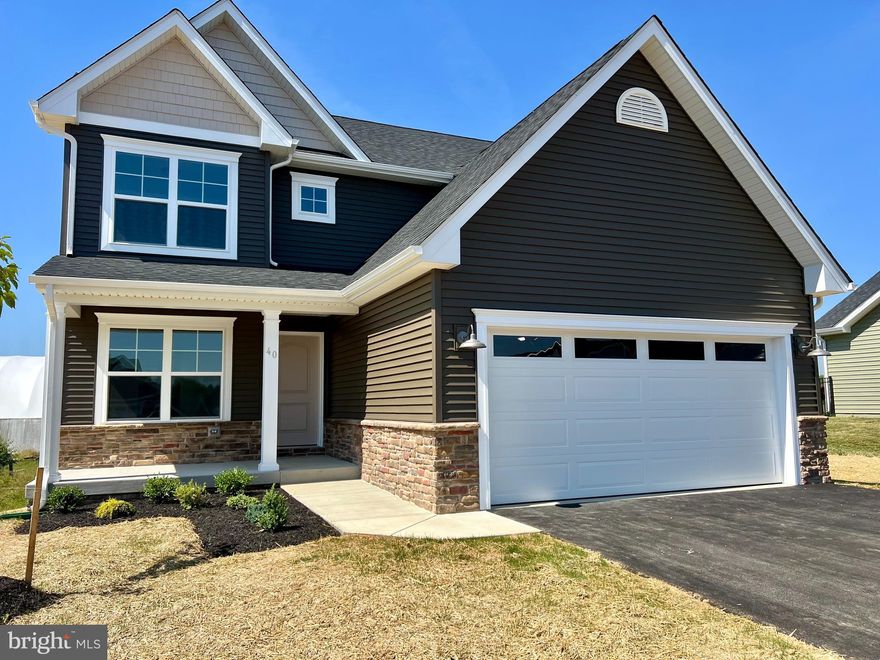 Ready for move in NOW!!! This colonial built by Panhandle Homes is on one of the last remaining lots in the tucked away community of Harvest Glen! Located at the end of the street in a cul-de-sac, this home has a lot to offer! The kitchen has beautiful 42” Painted Linen cabinets with dovetail construction and soft close hinges.  The countertops have been upgraded to a beautiful granite with a ceramic tile backsplash.  There is a large kitchen peninsula and stainless-steel, energy efficient GE appliances as well. There are three spacious bedrooms and two full bathrooms upstairs along with a half bath on the main level. The Owners Suite has a large walk-in closet. The Owner’s Bath has a dual vanity and a large ceramic tile shower with a custom glass shower door.  There is a full, unfinished basement with bathroom rough-ins – a perfect canvas for you to make this space your own! The home also comes with a 1-year builders’ warranty for your peace of mind and comes with a Trane HVAC system which offers a 10-year manufacturer’s warranty.  The outside of the house is wrapped in deep Espresso siding with Mocha shakes in the gables, and the front door is custom painted to match. The yard is professionally landscaped, adding to the beauty and charm of this home.