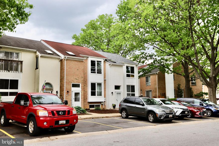 Absolute Stunning Lakeside Townhouse by Elkhorn Lake ! Fall in love with this beautifully renovated modern gem just steps from scenic Lake Elkhorn. This home has undergone a jaw-dropping transformation designed to delight the senses and refresh your lifestyle:  Brand new full-house painting;          Modern kitchen with all-new cabinetry and appliances;   Completely renovated bathrooms with new vanities;  New wood flooring throughout the entire home;  New windows,  and much more! The spacious main living area opens to a deck through two full sliding glass doors, seamlessly blending indoor and outdoor living. The fully finished walk-out basement features a fourth bedroom, a full bathroom with dual entrances, and a large family/gym room with dual sliding doors for added flexibility and natural light. Upstairs, the primary suite offers a private retreat with an ensuite bathroom, while the additional bedrooms provide ample space for guests, relaxation, or a home office. Enjoy lakeside living with Elkhorn Lake just a short walk away—perfect for walking, jogging, or simply taking in the view. Conveniently located near Costco,  The Mall in Columbia, and with quick access to I-95, commuting to the greater metro area is easy. Welcome to home!