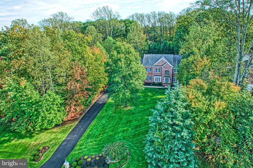 This stunning 6-bedroom, 5 & 1/2-bath home is being offered by its original owners and has just been beautifully updated throughout. The 6500 sq ft home features a unique and modern floor plan with refinished hardwood floors on both the main and upper levels. The bright white kitchen shines with new quartz countertops, brand-new appliances, and a large breakfast area with built-in cabinetry and ample storage. The kitchen opens to an oversized sunroom with treed views and access to the deck and gazebo—perfect for relaxing or entertaining. The family room features a gas fireplace and a wall of windows that fill the home with natural light.

The main level also offers elegant formal living and dining rooms, a private home library. There is also,a walk-in pantry, and a dedicated laundry room off the kitchen.  A large bonus room off the kitchen and garage makes an ideal mudroom, hobby room, or fitness space. Upstairs, you’ll find five spacious bedrooms—four with attached baths. The grand primary suite is a true retreat with two walk-in closets, a bright sitting area, and a stunning spa-inspired bathroom with a glass shower, dual vanities, and soaking tub.

The finished walkout lower level offers a sixth bedroom, fifth full bath, media room, and multiple recreation areas, along with abundant storage. Step outside to a covered travertine patio and a beautifully landscaped, easy-care backyard with privacy and space to enjoy the outdoors.

Situated in a prime location, this home offers easy access to Fairfax Corner, Fair Oaks Mall, and is less than 15 minutes from the Vienna Metro, Downtown Vienna, and Dulles Airport. This is a rare opportunity to own a home that combines luxurious living with convenience and practicality. Located in the sought after Dartmoor Woods neighborhood this home feeds to Waples Mill ES, Franklin Middle & Oakton HS. OPEN SUNDAY 11/2, 1-3:00 pm
