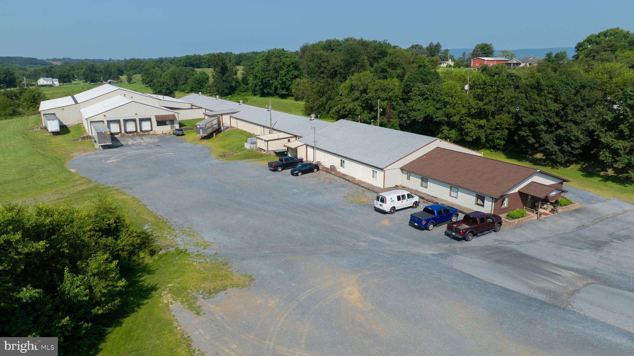 Over 43,000 sq.ft. light industrial and warehousing facility on over 12 Acres. Convenient location is just minutes to Rte. 61. Over 20,000 sq. ft. of the space is set up as office and light production/assembly areas. This space is heated and cooled. The remainder of the facility is a combination of warehouse areas with ceiling heights ranging up to 18 ft. These areas are serviced by 6 loading docks and several drive-in doors. The majority of this warehouse space is heated and there are some unheated sections as well. The majority of the property is grass or meadow covered and there are several parking areas, primarily gravel in nature.