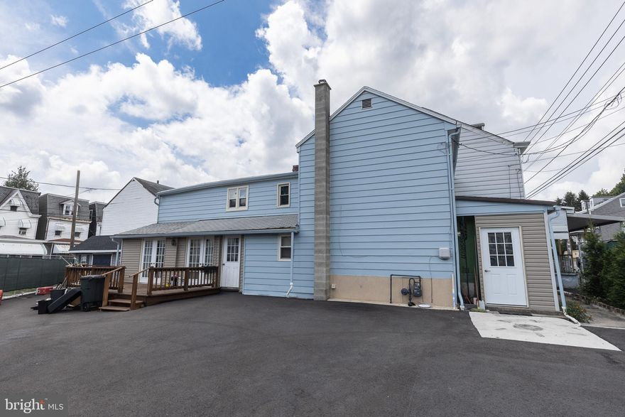 Corner lot, lots of parking!  Home has new Brazilian cherry hardwood  flooring  in most rooms.  Kitchen has new cabinets, LED lights, new stove, refrigerator that is either a freezer or refrigerator  and vinyl flooring.   First floor master bedroom with full bath.  Upstairs there are two bedrooms and a bonus room in the back and a full bath.  In the hallway there is a walk in closet.  Back downstairs there are two enclosed porches, one out front, one on the side that leads outside to the deck.   New gas furnace, most of the plumbing in the basement has been updated.  Some new windows. Outside the blacktop is all new, parking for at least 6 cars.  Shed, and new fencing.