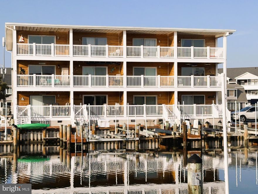 Welcome to Newport Bay West #2, the perfect retreat for those seeking the ultimate Ocean City lifestyle. This ground floor condo features 2 spacious bedrooms and 2 bathrooms. The kitchen seamlessly overlooks the bright and airy living area. Step out onto the balcony and take in the stunning canal views—the perfect spot to unwind after a day of Ocean City adventures. The home comes complete with a deeded boat slip and lift just steps from your deck. Don't miss out on this exceptional opportunity to own a piece of paradise in Newport Bay West.