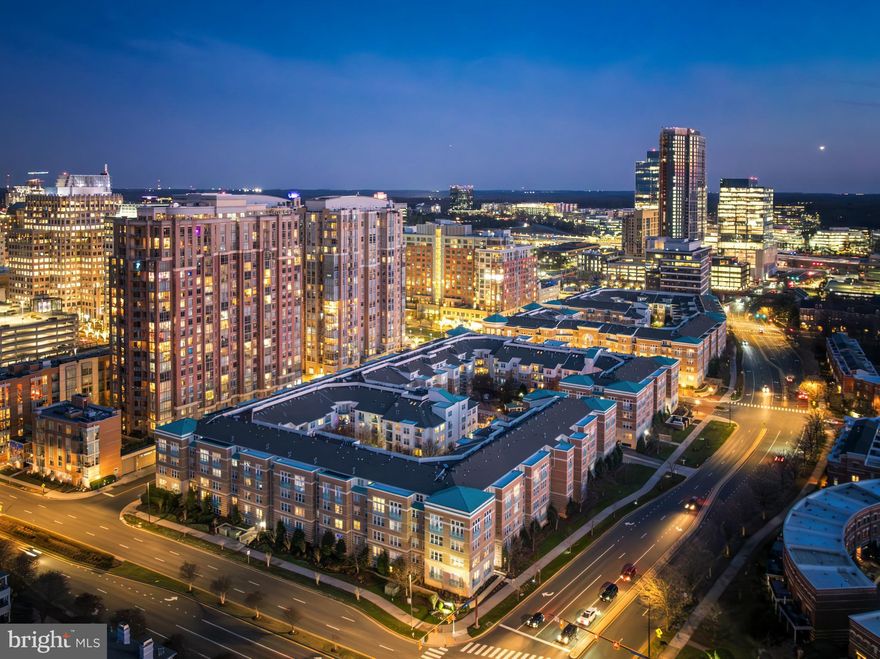 Welcome to The Savoy at Reston Town Center — where sophisticated living meets unbeatable convenience! This light-filled, open-concept 1 bed / 1 bath condo offers everything today's buyers want: hardwood flooring in the main living area, maple cabinetry with granite countertops, and stainless steel appliances in the kitchen. The remodeled bathroom boasts a seamless glass shower enclosure and a stylish vanity topped with granite. Recent upgrades include a 2020 HVAC system, 2021 water heater, a smart thermostat, and a Wi-Fi enabled, front-loading washer and dryer. Work from home? You’ll love the built-in desk space. The oversized bedroom comfortably fits a king-sized bed, and the Juliet balcony offers a charming outdoor touch. One assigned garage parking space near the elevator is included, with additional spaces available for lease in the Town Center. Plus, enjoy some of the lowest condo fees in Reston Town Center! The Savoy’s resort-style amenities include a fitness center, game room, meeting rooms, computer center, and a private outdoor area with a gazebo. Step outside and you’re in the heart of Reston Town Center, home to premier shopping (Anthropologie, Lululemon, Sephora, South Moon Under), award-winning dining (Barcelona Wine Bar, Jackson’s, North Italia, Fogo de Chão, Bartaco), and entertainment options like Bow Tie Cinemas and Pinstripes. Enjoy seasonal events including outdoor summer concerts, art festivals, ice skating in the winter, farmers markets, and holiday parades—all just steps from your door! Commuters will love the short stroll to the RTC Metro Station, easy access to Dulles Toll Road (267) and I-66 to DC, and being under 10 minutes from Dulles International Airport. Your perfect blend of luxury, lifestyle, and location awaits at The Savoy!