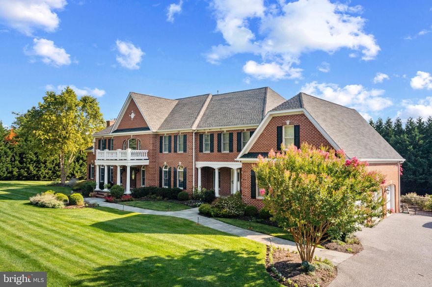 Exceptional Properties. Exceptional Clients. Tucked down a private drive on 1.88 acres, experience the perfect blend of charm and sophistication with this stunning, custom built, all brick colonial in a location that offers both privacy and convenience. As you enter into the elegant two-story foyer with dual curved staircases, you will be greeted by gleaming hardwood floors, high ceilings, beautiful moldings and trims, and an abundance of space at close to 8200 finished above grade square feet. This house is truly an entertainer's dream both inside and out. The main level floor plan includes oversized foyer, sitting room, dining room, living room with gas fireplace, study, media room with gas fireplace and full bar, breakfast room, kitchen, morning room, mudroom, laundry room and two half bathrooms.

Upstairs you'll find a luxurious primary suite including a dual-sided gas fireplace that warms both the bedroom and sitting room, a spa bathroom, two walk in closets with islands, high tray ceilings, coffee bar/beverage center and a second laundry room. Four additional bedrooms, two of which have designated  en-suite full bathrooms and two that share a Jack-and-Jill bathroom, will wow you with their size and gigantic closets.

Downstairs boasts 4000 additional square feet to include a bar/kitchen, large entertainment room with projector, pool table/foosball table, 6th bedroom with an en suite full bathroom and sitting room (perfect for in-laws or an au pair), exercise room, multiple storage rooms, a second full bathroom (on the side of the house closer to the pool) and walk up stairs out to your backyard oasis.

The remarkable outdoor space checks every box — a resort-like pool, gigantic stone patio with a full outdoor kitchen with large island and dining table for guests to sit down for dinner and mingling, brick fireplace with outdoor TV and lounge seating, fun playset on rubber mulch bed, and unlimited, level grassy spots to spread out onto for any and all outdoor recreational activities and games.

Additional highlights include the oversized 3 car-garage, surround sound, Lutron light system, generator, plantation shutters, professional landscaping, alarm system and more.

This is an incredible opportunity to own a spectacular property in a secluded enclave that is still just minutes from everything you want— schools, restaurants, coffee shops, grocery stores, 695/83, parks — at your fingertips.