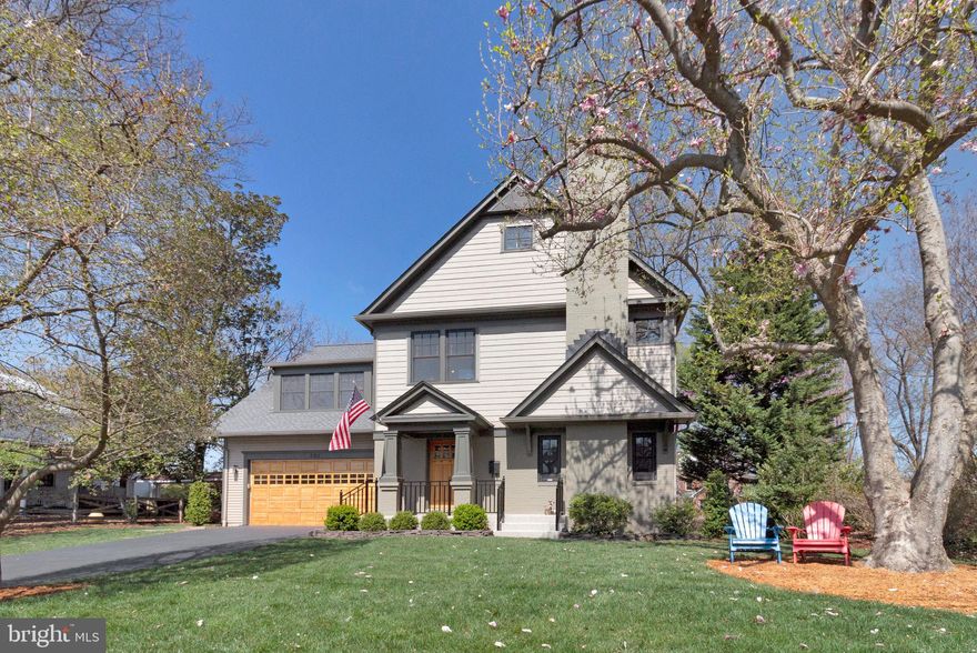 Incredible Opportunity in the Heart of Falls Church City.   Spacious, Handsome and Sun-Filled Home on Oversized Flat Lot,   on a Quiet Street that's steps from Metro , Restaurants, Shopping, Farmer's Market and All that Falls Church has to offer.  Charming Front Porch and Landscaped Front Yard.  Recently Refinished Hardwood Floors on Main Level.  Custom Moldings, Lighting, & Fixtures Throughout. NEW (2024) Roof, too. Spacious Living Room with Wood-Burning Fireplace. Gorgeous Formal Dining Room with Ample Space for Large Table.  TRUE Chef's Kitchen with Very Large Island/Breakfast Bar, Pantry, Ample Counter and Storage Space and Stainless Steel Appliances.  Family Room with Soaring Ceilings, Gas Fireplace, Built-Ins and Walls of Windows. Main Level Powder Room, ample Coat Closets, Loads of Storage and Sliding Glass Doors to Amazing Deck overlooking truly Gorgeous Yard.   Spacious Primary Suite with BIG Walk-In Closet, King-Sized Bedroom and Handsome Bathroom w/Separate Tub/Shower.  Huge Guest Room with Newly Updated Full Bath and Loads of Storage/Closet Space. Two additional Large Bedrooms and Hall Bath and a Wonderful Laundry Room complete the Sunny Upper Level.  Bonus HUGE Attic! Great for storage, but could easily be finished into additional living space if desired, too.  Spacious Lower Level with Great Ceiling Height that's Perfect for Storage.  Could also be easily finished into playroom, recreation room, gym or more.  Oversized Two-Car Garage with Custom-Finished Floor and Plenty of room for Two Cars + Bikes, Storage & Workshop.  This is a must-see home in a superb location!