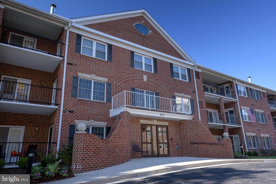 Freshly painted, main-level condo in Broad Creek of Heritage Harbour. Private balcony backs to woods with mature trees and wildlife. Secure building, assigned parking in underground garage with storage room and elevator. Wonderful community amenities! Buyer pays one-time rec fee of $2,000 at settlement. A wonderful home for 55 and up!