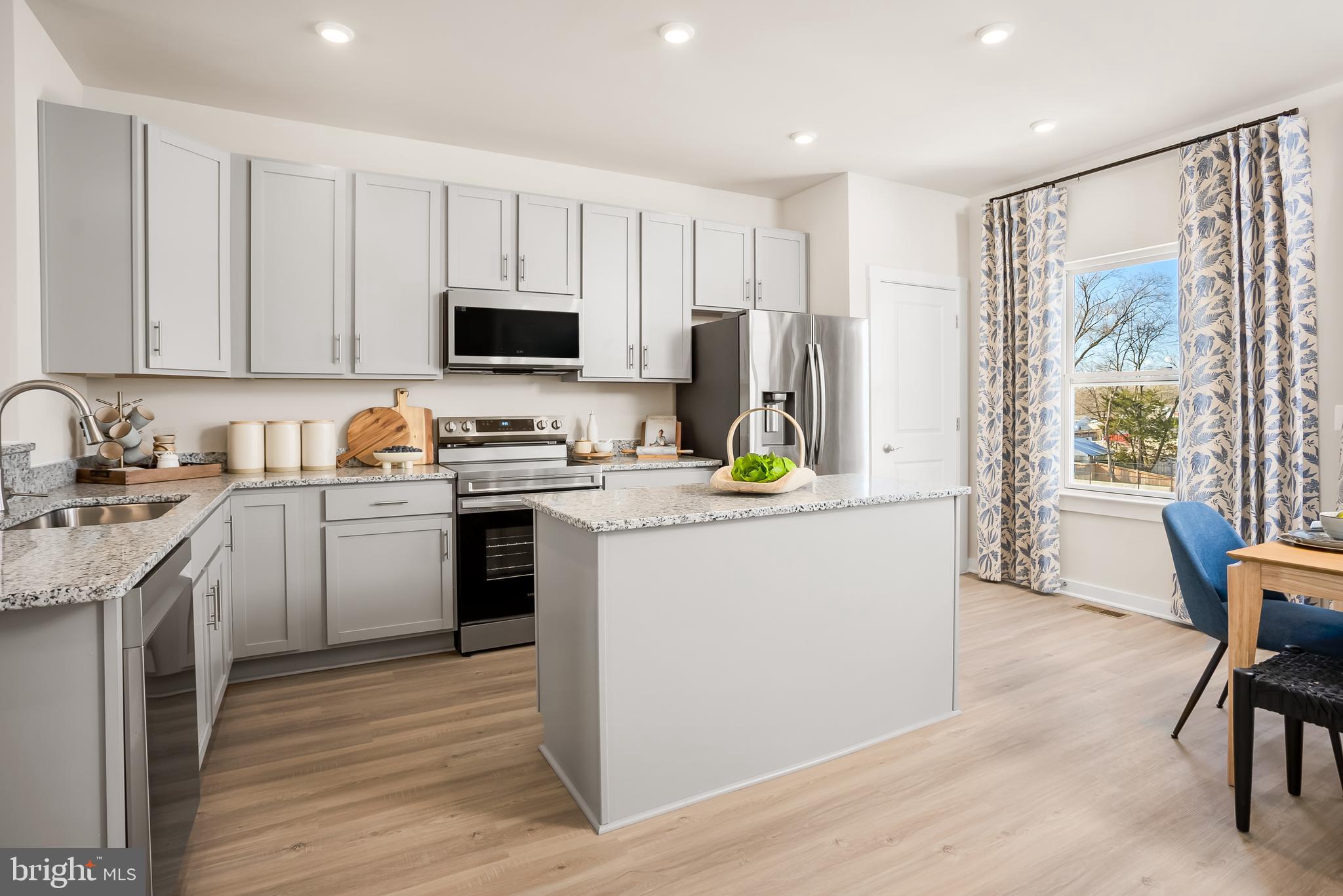 Rossum Crossing is Winchester's newest and most popular townhome community, conveniently located near shopping and dining options.
The St. Paul Townhome features three bedrooms, two and a half baths, and a one-car garage. The main floor boasts an open-concept floor plan, with a spacious family room that flows into a fully equipped kitchen. The kitchen includes an island, a pantry closet, and a breakfast nook. This level also features a powder room and provides access to a composite exterior deck, perfect for relaxing or entertaining guests.
Upstairs, you'll find the luxurious Owner's Bedroom, complete with a spacious walk-in closet and an Owner's Bath. There are two additional bedrooms and another bathroom on this level, along with a conveniently located washer/dryer.
The lower level offers a spacious finished Recreation Room, as well as a rough-in for a half bath. Additionally, there is a one-car private garage and extra parking available in the driveway.
We are excited to show you how you can personalize this design to fit your family's lifestyle and needs. We can’t wait for you to call the St. Paul home.
Photos of a similar model
