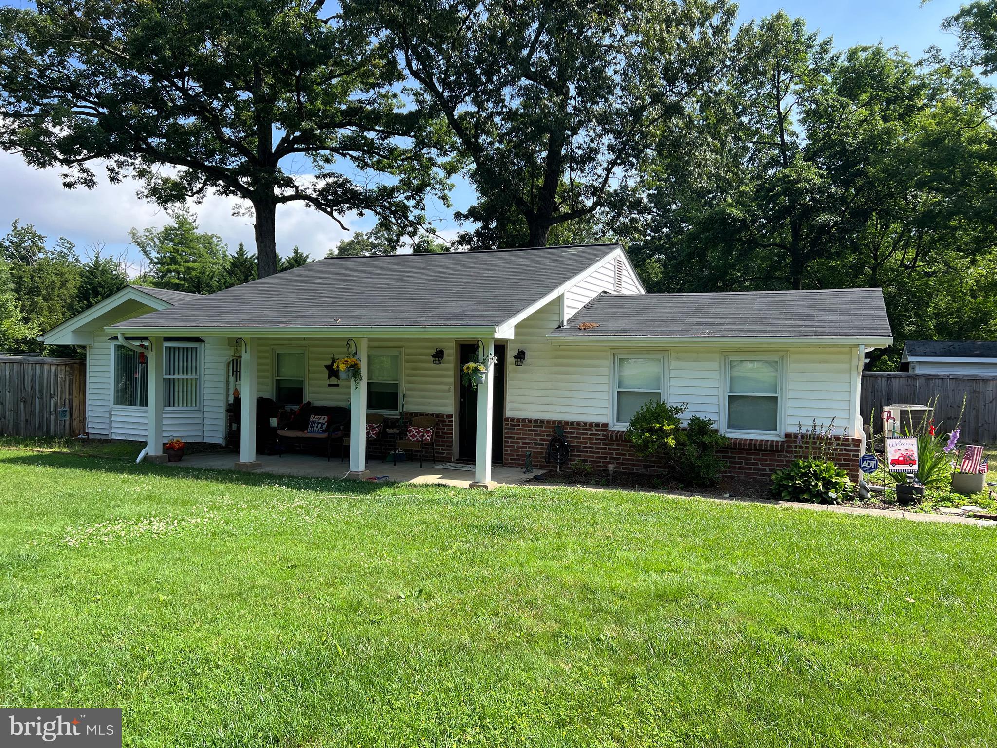 Almost an acre in popular community of Wiley with NO HOA, minutes from, VRE, Mason Neck and Pohick Bay. This large inviting front porch rambler has lots of character inside & out with tons of upgrades. Beamed/cathedral ceilings, gourmet kitchen with all the updates as well as the bathrooms. Fourth bedroom great for craft/home office(no closet). Large rear yard with privacy fence(2023), shed and fire pit. Detached 2 car garage with wall mounted garage door opener(2023) with separate area for a gym/office/craft area, addt'l rough-in for bathroom. Hot water heater(2019), Heat pump(2020), New roof w/ gutter system(2021), Retractable kitchen storm windows(2021), Air handler & EcoBee Thermostat(2022).